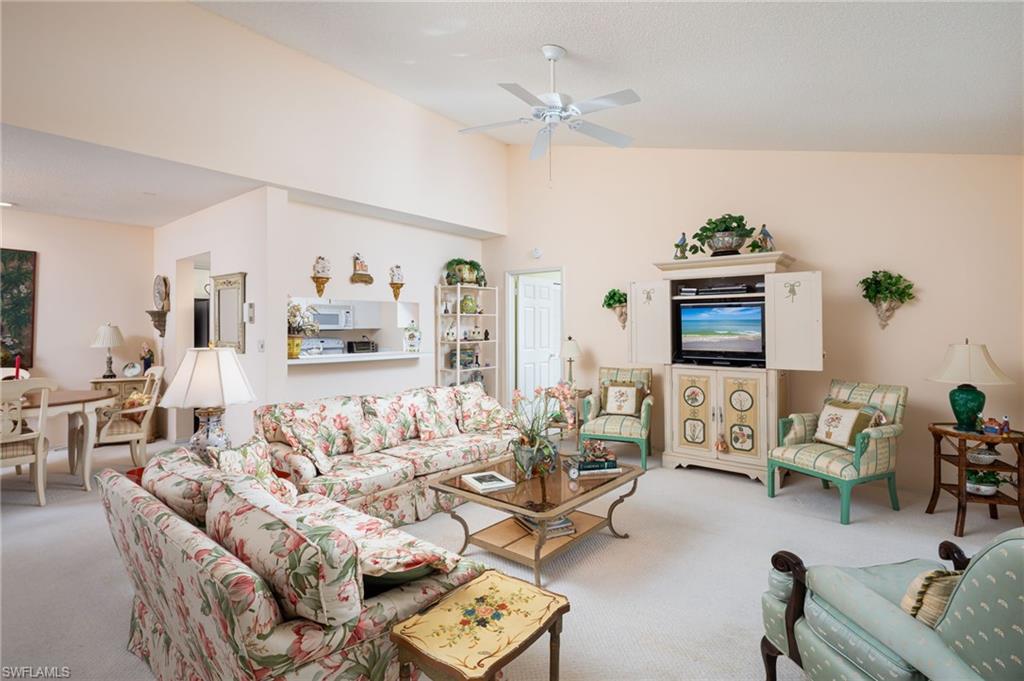 Enjoy lots of sunshine and volume ceilings in this open floor plan condo in Pelican Bay.  This condo offers an enclosed, private stairway to the second-floor residence.  The great room and dining room are open to one another giving the residence a spacious feeling.  The bedrooms each have an en-suite bath so that the split bedrooms function like a dual main bedroom floorplan.  The kitchen is light, bright and well-maintained with a pantry cabinet for those who cook.  Both bedrooms are graciously sized with ample closet space and space for a sitting area/desk and include plantation shutters for privacy. This unit offers a glass enclosed Florida room which acts as additional living space for a den/family room or extra guests.  The laundry is in unit, and there is additional storage outside the unit near the entrance.  All this in the premier community of Pelican Bay, which offers all members the use of its 2 beach restaurants, tennis pavilion, fitness center, kayaking, biking, walking paths and of course beach access! This unit is located in Glencove, which is just a short stroll the beach tram, and minutes from Waterside Shops, The Artis, Mercato and many of the great places that Naples has to offer.