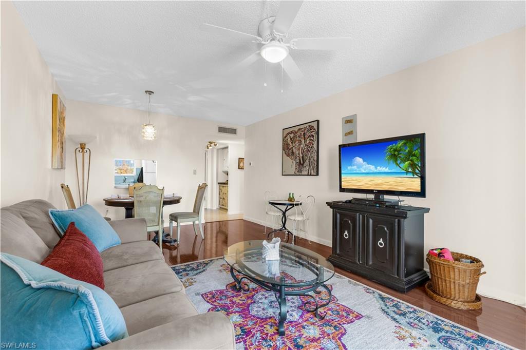 Enjoy the perfect Naples getaway in this beautifully furnished 1-bedroom, 1-bathroom condo at Turtle Lake Golf Colony. Just a short drive to Naples’ stunning beaches, shopping, dining, and golf courses, this is the perfect seasonal retreat. This bright and inviting third-floor corner unit features an open living space with stylish décor, comfortable seating, and a relaxing atmosphere ideal for unwinding after a day in the sun. The fully furnished interior includes a cozy living room, dining area, and a well-equipped kitchen, making it easy to feel right at home. Thoughtfully designed for comfort, this spacious one-bedroom layout offers ample closet space and a well-appointed living area. The full bathroom is conveniently located just outside the bedroom, and the home provides a peaceful, inviting setting to enjoy your morning coffee or unwind in the evenings. Located in a desirable community, guests have access to amenities including a heated pool, clubhouse, and tennis courts. Ideal for vacationers, seasonal residents, or those looking to experience the Naples lifestyle.