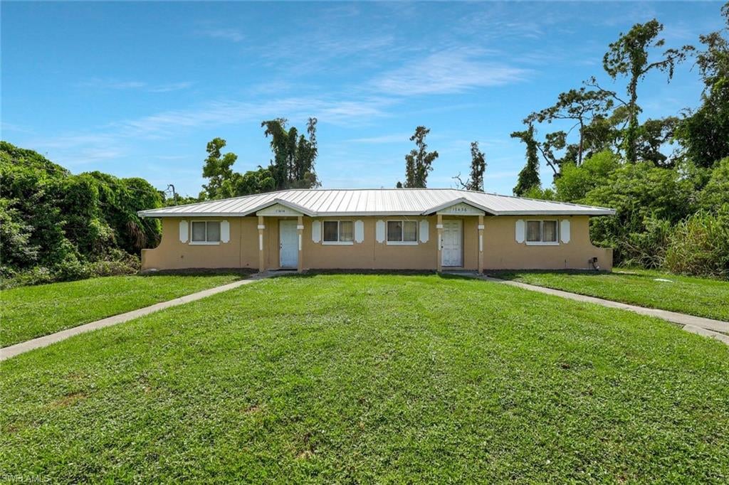 One or more photo(s) has been virtually staged, AI generated or rendered.  INVESTMENT OPPORTUNITY IN FORT MYERS! This two-unit multifamily property offers approximately 2,160 square feet of building area situated on a spacious, approximately 20,720-square-foot lot, providing an excellent opportunity for investors or buyers seeking a versatile income-producing property. Built in 1985, the property features several significant improvements, including a metal roof installed in 2023 and a septic drain field replaced in 2020. The A/C system serving 17434 was replaced in 2020, while the A/C system serving 17436 was installed in 2012. The established two-unit configuration offers the potential for rental income, portfolio expansion, or an owner-occupant investment strategy. Conveniently located in the 33967 area of Fort Myers, with access to shopping, dining, major roadways, and all that Southwest Florida has to offer. A compelling multifamily opportunity with valuable recent improvements already completed.