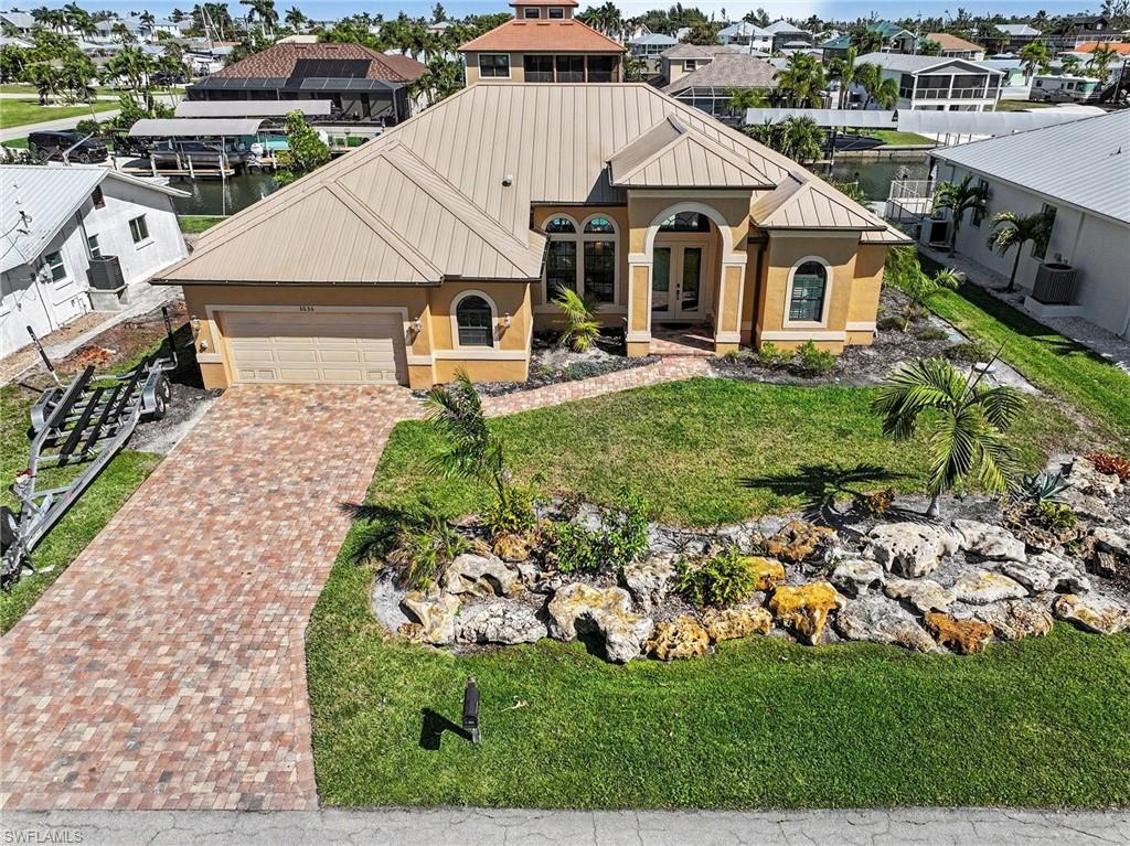 Highlights: Over 100 feet of brand-new composite dock & pilings • Dual 14,000 lb boat lifts • Fully furnished, turnkey • Never flooded • Expansive outdoor entertaining area • Quick Gulf access

Welcome to your island escape at 3656 Emerald Ave in the heart of St. James City on beautiful Pine Island—where the pace slows down, the sunsets feel a little brighter, and life revolves around the water.
From the moment you arrive, you’ll feel the easy rhythm of true island living. This waterfront retreat is designed to let you enjoy the coastal lifestyle to the fullest, whether you're heading out for an early-morning fishing trip or gathering with friends as the sky turns shades of orange and pink over the water.
Step outside and you’ll discover what makes this property special: over 100 feet of brand-new composite dock stretching along the waterfront, complete with two new 14,000lb boat lifts so your boats are always ready for adventure. With quick access to some of Southwest Florida’s most incredible fishing and boating waters, days spent exploring the surrounding islands, sandbars, and the open waters of the nearby Gulf are simply part of everyday life here.
The expansive outdoor entertaining area poolside invites you to relax, grill fresh-caught fish, host sunset cocktails, or simply unwind while watching boats drift by. It’s the kind of space where memories are made—barefoot evenings, salty breezes, and laughter carrying across the water.
Inside, the home is sold fully furnished, so you can step right into the island lifestyle from day one. Light-filled living spaces create a welcoming atmosphere that feels both comfortable and coastal, making it the perfect retreat after a day on the water. Featuring an open floor plan, 2 bedrooms with pool access, and a third bedroom for all your guests. The master ensuite bathroom has a deep soaking tub, large walk-in shower, dual sinks, and dual walk-in closets for the perfect coastal retreat.  The second bath has pool access, making it easy to transition from boating and the pool to everything Saint James City has to offer. 
For added peace of mind, the home has never flooded, offering confidence along with its incredible waterfront setting. 
Tucked into the charming community of St. James City, you’re just moments from local marinas, waterfront restaurants, and the laid-back island culture that makes Pine Island so beloved. Here, neighbors wave as they pass by the boat, trade fishing stories at sunset, and every day feels a little like vacation.
If you’ve been dreaming of a place where boating, fishing, and waterfront living come naturally, 3656 Emerald Ave is more than a home; it’s your gateway to island life.