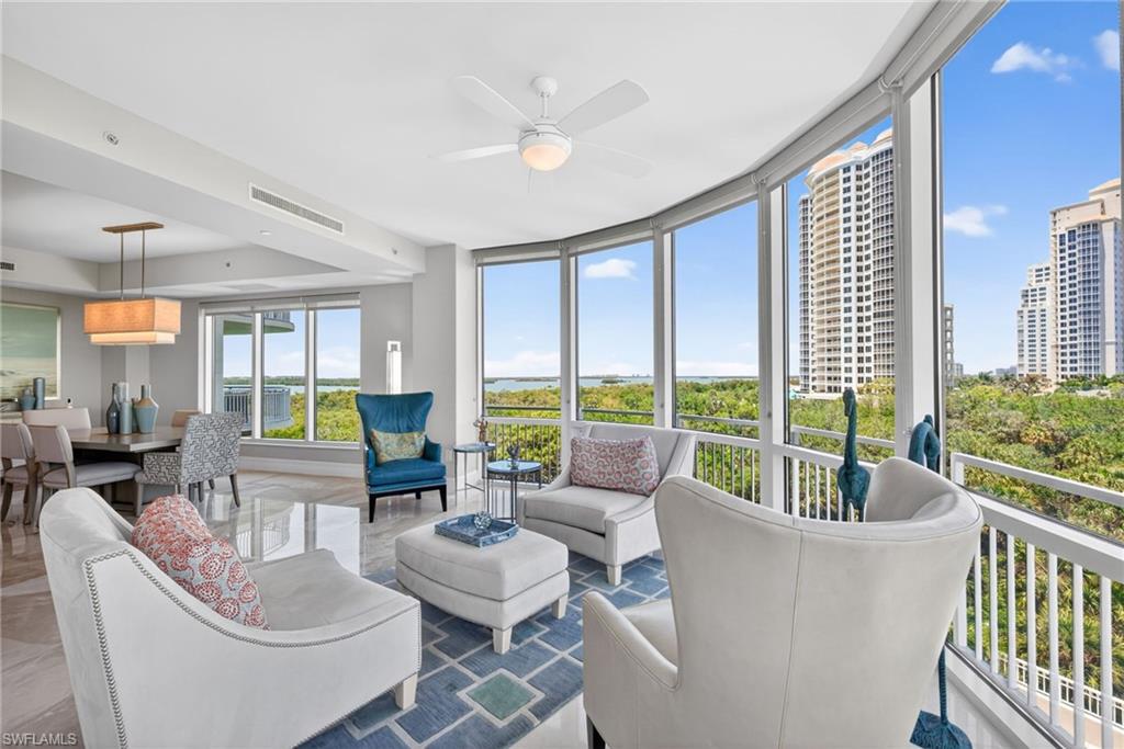 Located in the prestigious Bonita Bay community in the coveted Tavira Building. This 5th floor condo is an end unit with a PRIVATE elevator, over 4,100sqft of living space, 716sqft of outdoor space, 4 bedrooms, 3.5 bathrooms & 2 parking spots w/storage unit.  Residence 504 is being offered Furnished and it boasts impact windows, electric shutters on the screened-in lanai, 2 A/C units, marble flooring, gas cooktop in the kitchen, grill on the back balcony, window treatments on all the windows and a gas fireplace which offers an exceptional blend of luxury, privacy, and sweeping Southwest Florida beauty. This elegant sky home showcases expansive living spaces filled with natural light, floor-to-ceiling glass, and oversized lanais designed to capture breathtaking views of the bay, golf course, and sparkling Bay to Gulf sunsets and Eastern sunrises. Thoughtfully designed for both comfortable everyday living and effortless entertaining, the residence features a spacious open-concept floor plan, a gourmet kitchen with premium appliances and custom cabinetry, luxurious owner’s suite accommodations, and beautifully appointed guest spaces. Refined finishes, generous storage, and private elevator entry elevate the experience throughout. Residents enjoy access to Bonita Bay’s world-class amenities, including private beach access, championship golf, marinas, miles of walking and biking trails, fitness facilities, tennis, pickleball, dining, and an unmatched lifestyle surrounded by lush natural preserves and waterfront beauty. A rare opportunity to experience elevated coastal living in one of Southwest Florida’s most sought-after luxury communities.
