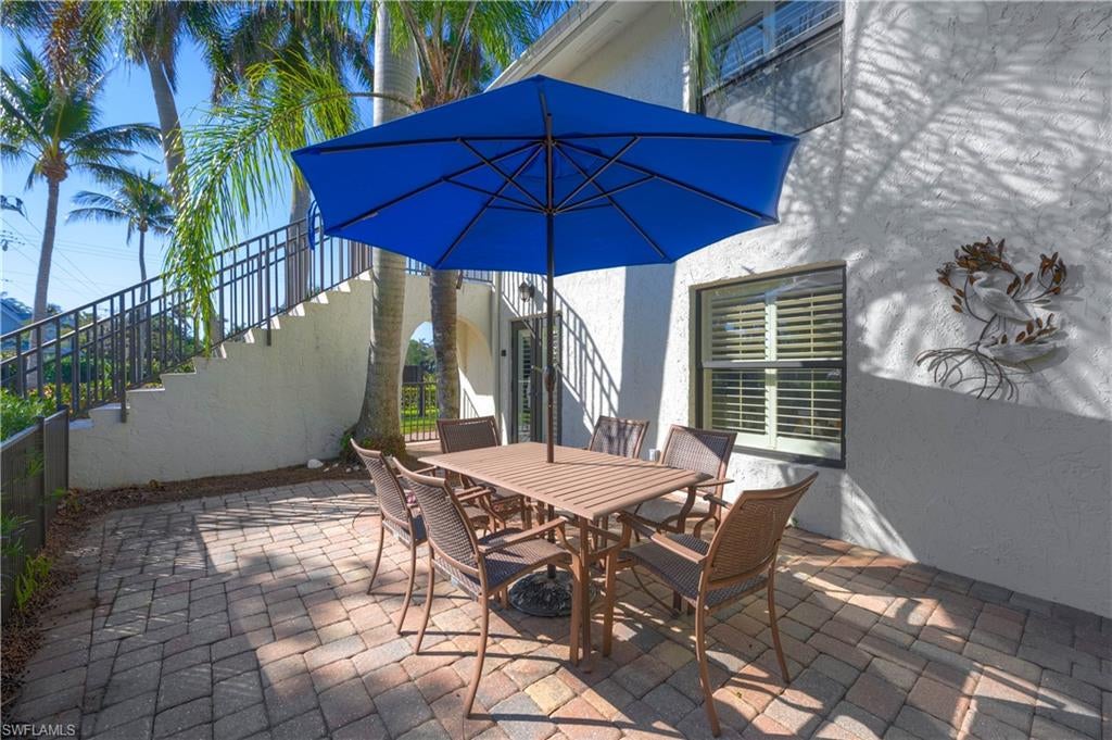 A little slice of Olde Naples with your very own private patio! This remodeled first-floor, one-bedroom, one-bath end-unit condo is tucked into peaceful Olde Naples, just a 10 minute walk from 8th Ave S Beach Access. Take an even shorter stroll in different directions and you'll find yourself on Fifth Avenue South, Third Street South, or Cambier Park. Whether you love starting the day at the beach, heading downtown for dinner and a little shopping, or enjoying a concert or Art Fair or a little tennis match at nearby Cambier Park, there is so much to enjoy right outside your front door.

The private patio is a "RARE FIND" in the heart of Olde Naples.  It gives you your very own outdoor private enclave to soak up Florida's sunshine and beautiful blue skies. This remodeled unit includes your very own in-unit laundry and your own dedicated parking space for easy everyday living easy. New water heater and brand-new flood panels have been installed to all exterior windows and doors to provide added peace of mind during storm season.

This meticulously cared for 6-unit condominium building and association is professionally managed - making ownership easy.  As an owner in the Maison Du Soleil Condominium Assoc. you would own 15.36% of the Association.  That includes The LAND, so consider what your portion of the value of the land would be in this very desirable area!

There is also flexibility in how you use the property. Weekly rentals are permitted by the HOA documents, so it's possible to enjoy it as your own Naples getaway and/or have it rented while you are away.  For buyers considering an investment, that opens the door to rental income alongside the long-term potential of owning a fractional share of land in the heart of desirable Olde Naples.  HOA policies may be in conflict with alleged City of Naples rental rules so prospective buyers are encouraged to do their own research.  

With a remodeled interior, recent improvements, flexible HOA rental restrictions, and a location that puts so much within walking distance, this condo is well worth not just a look, but a second look.
