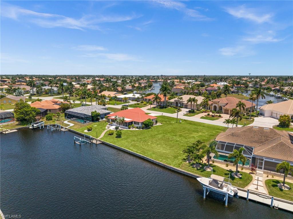 Build your Southwest Florida dream home on this exceptional waterfront homesite in Burnt Store Isles! Offering 84 feet of city-maintained seawall and true sailboat access with no bridges, this prime waterfront lot provides direct access to Charlotte Harbor and the Gulf of America, making it a boater's paradise. Situated on an extra-wide canal basin, the property enjoys beautiful basin and preserve views while providing plenty of room to maneuver your boat with ease. This custom home site offers the perfect setting to create your ideal waterfront retreat. Located within the sought-after deed-restricted Burnt Store Isles community, residents enjoy a beautiful waterfront and golf course lifestyle with easy access to Burnt Store Marina, shopping, dining, entertainment, US-41, and I-75. Whether you're an avid boater, golfer, or simply looking to build your dream home in one of Punta Gorda's premier waterfront communities, this rare homesite offers endless possibilities.
