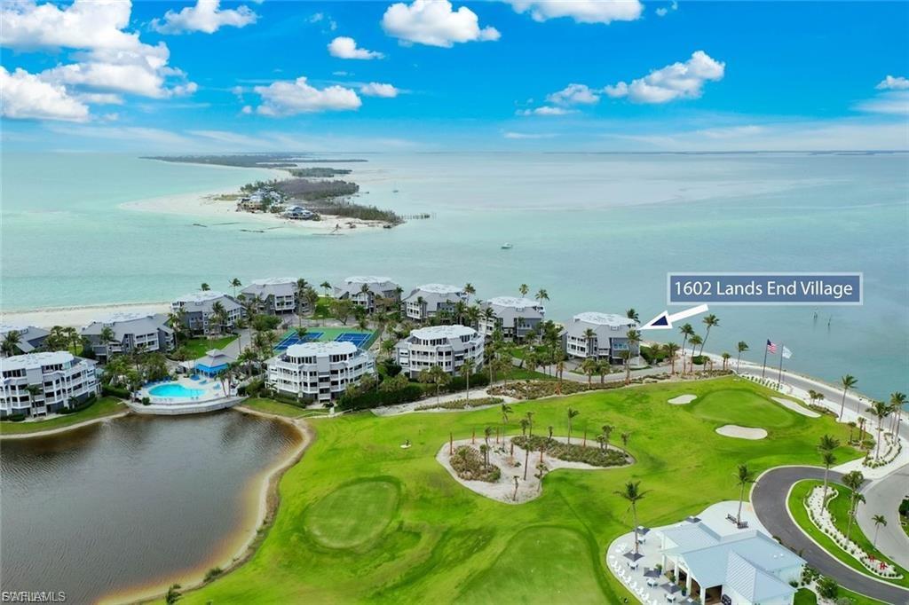 Perched at the northernmost point of Captiva Island, Lands End 1602 is a rare end-unit penthouse offering an unmatched combination of privacy, luxury, and breathtaking natural beauty. Located within the exclusive Lands End Village, this 3-bedroom, 3-bathroom residence overlooks the serene waters of Red Fish Pass, delivering sweeping 180-degree, unobstructed views of Pine Island Sound and beyond. Spanning over 2,300 square feet across two elegantly designed levels, the interior is bathed in natural light and finished in a serene palette of neutral tones. The open floor plan gracefully balances relaxed island living with refined entertaining, featuring a gourmet kitchen with rich wood cabinetry, granite countertops, a breakfast bar, dining areas. The spacious living and den areas seamlessly extend to an under air enclosed lanai and an expansive sundeck—perfectly positioned to capture both sunrise and sunset over Captiva’s breathtaking seascapes. Two guest bedrooms with en-suite baths and each with its own private terrace are thoughtfully situated on the main level, providing privacy and comfort for family and guests alike. Upstairs, the penthouse-level primary suite is a tranquil retreat framed by walls of glass showcasing panoramic coastal views. A large, private newly tiled deck invites moments of solitude under the stars, while the spa-inspired bath pampers with a jetted soaking tub, double vanities, sunlit skylights, and a walk-in shower. Additional comforts include under-building parking and storage, an upstairs laundry room, new roof, new AC, new irrigation and landscape lighting and tasteful furnishings offered with few exceptions. Beyond the residence, Lands End Village envelops you in the essence of resort-style island living. Enjoy direct beach access, a stunning updated association pool and hot tub surrounded by a sun-drenched patio with plush loungers, an outdoor shower, gas BBQ grills, a community house, tennis and pickleball courts and a private fitness center. Whether you’re seeking a serene personal sanctuary, a luxurious seasonal escape, or a high-potential investment, Lands End 1602 offers a rare opportunity to own one of Captiva’s most coveted penthouses—where nature, privacy, and timeless elegance converge. offered furnished with all custom curtains and Hunter Douglas blinds included.  This is island living at its absolute finest.