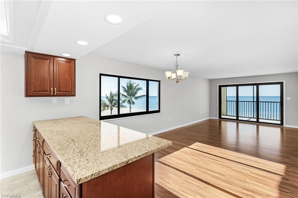 A rare opportunity to own a 3 bedroom DIRECT GULF-FRONT residence at Cascades Condominium, with WATER VIEWS FROM EVERY WINDOW! With just 12 residences in the building and no condo offered for sale here in six years, opportunities at Cascades are few and far between. This fully renovated 4th floor CORNER UNIT takes full advantage of its exceptional beachfront position, with panoramic water views and abundant natural light throughout the residence. The updated interior features new kitchen and bathroom cabinetry, granite countertops, new appliances, a tray ceiling in the kitchen, plantation shutters, new light fixtures, new flooring throughout, a new A/C and new water heater. The electrical system was completely updated in 2024. Impact-resistant windows and electric hurricane shutters provide additional protection and convenience. The spacious primary suite features an ensuite bathroom with designer finishes and a custom walk-in closet. A split-bedroom floor plan provides privacy for family and guests, while the large in unit laundry room adds valuable storage and everyday convenience. Step onto the lanai for a front-row view of the Gulf and spectacular nightly sunsets, or simply enjoy the water from inside every window in this corner residence captures a water view. Downstairs, the white sand of Fort Myers Beach is just steps away. Under building covered parking and a private storage cage are also included. Cascades offers an intimate beachfront setting in a convenient mid island location near Publix, Snook Bight Marina, Newton Park, and popular waterfront dining including Junkanoo and Fresh Catch. With three bedrooms, direct Gulf frontage, a coveted corner position, water views from every window, extensive renovations, and only 12 residences in the building, this is a truly unique opportunity on Fort Myers Beach. *Some listing photos have been digitally enhanced for presentation purposes.