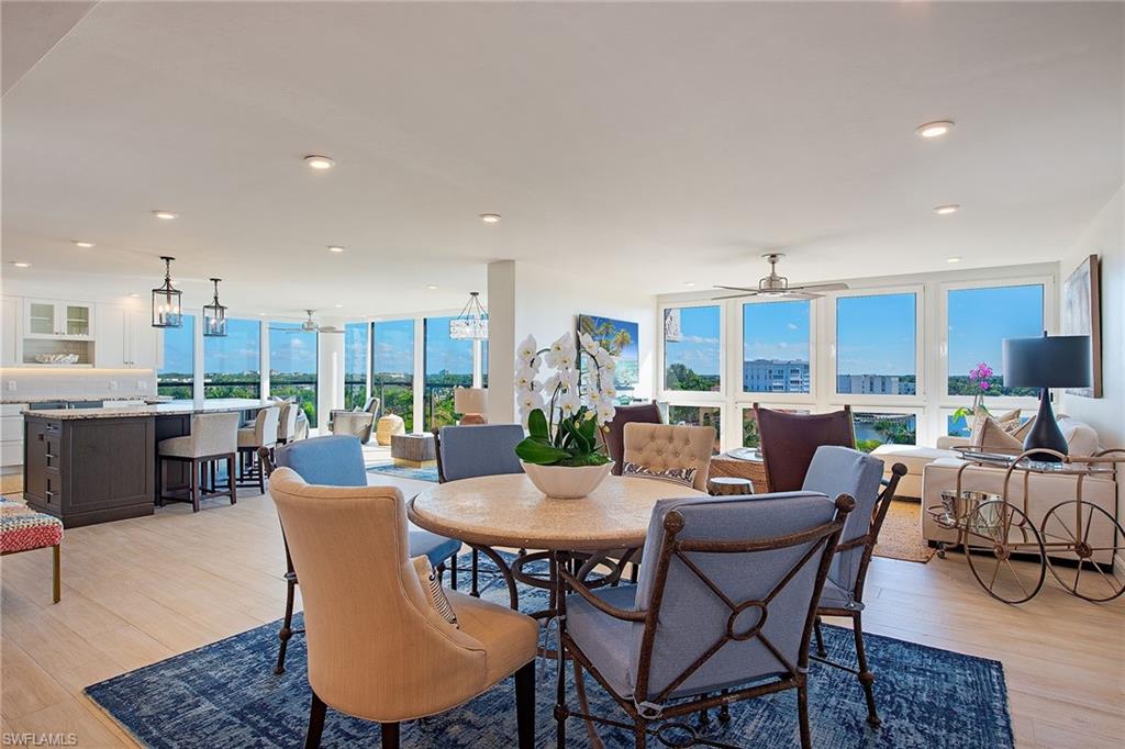 Stylish and sophisticated, this totally renovated residence offers spectacular panoramic views of the SHIMMERING Venetian Bay and the glamorous city lights through floor-to-ceiling walls of glass, complemented by tranquil Gulf views from the main living area. Encompassing over 2,500 square feet, the thoughtfully reimagined floor plan offers three bedrooms, three baths, and a versatile flex space ideal for a small den or home office. The remastered living areas flow seamlessly into a beautifully appointed chef's kitchen featuring custom cabinetry, quartz countertops, an induction cooktop, and premium appliances. State-of-the-art LED and custom lighting enhance the refined interiors throughout. All three bathrooms offer tasteful custom cabinetry and marble countertops, while the generous primary suite features a walk-in closet and a luxurious bath with an oversized walk-in shower. Additional enhancements include customized closets, an updated air-conditioning system with Nest control. Offered furnished and fully equipped, this exceptional residence provides an effortless opportunity to immediately begin enjoying the beachfront lifestyle and all that Naples has to offer.