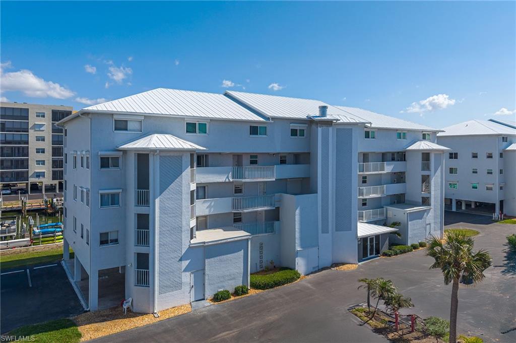 2 story 2 bed/2.5 bath Royal Pelican townhome. Turnkey! 2 master en-suites and 2 lanais plus a guest 1/2 bath. Updated Kitchen new stainless fridge. Tile flooring throughout the main floor. This home is light a bright and offers great canal water views and eastern exposure for late afternoon sun protection. The laundry room is conveniently located in the lanai off the main bedroom. Enjoy peace of mind with a new impact resistant window in bedroom. Added benefits include: New plumbing throughout the entire building, new metal roof, secure lobby. New paint, landscaping and pool expansion in process. Lanai's will be updated in April 2025 with new paint, railings and screens. Royal Pelican offers 2 pools and 2 shuffle boards, BBQ Grills, Picnic Tables, clubhouse with large recreation room, restrooms and kitchen. EBIA Amenities include: Pickle ball, Tennis, Bocce Ball, Deeded Beach Access, Beach Parking, Putting Greens, Driving Cage, Chipping Greens, Walking Paths and Fishing Pier. Boat slips available for purchase. Call today to learn more about this opportunity.