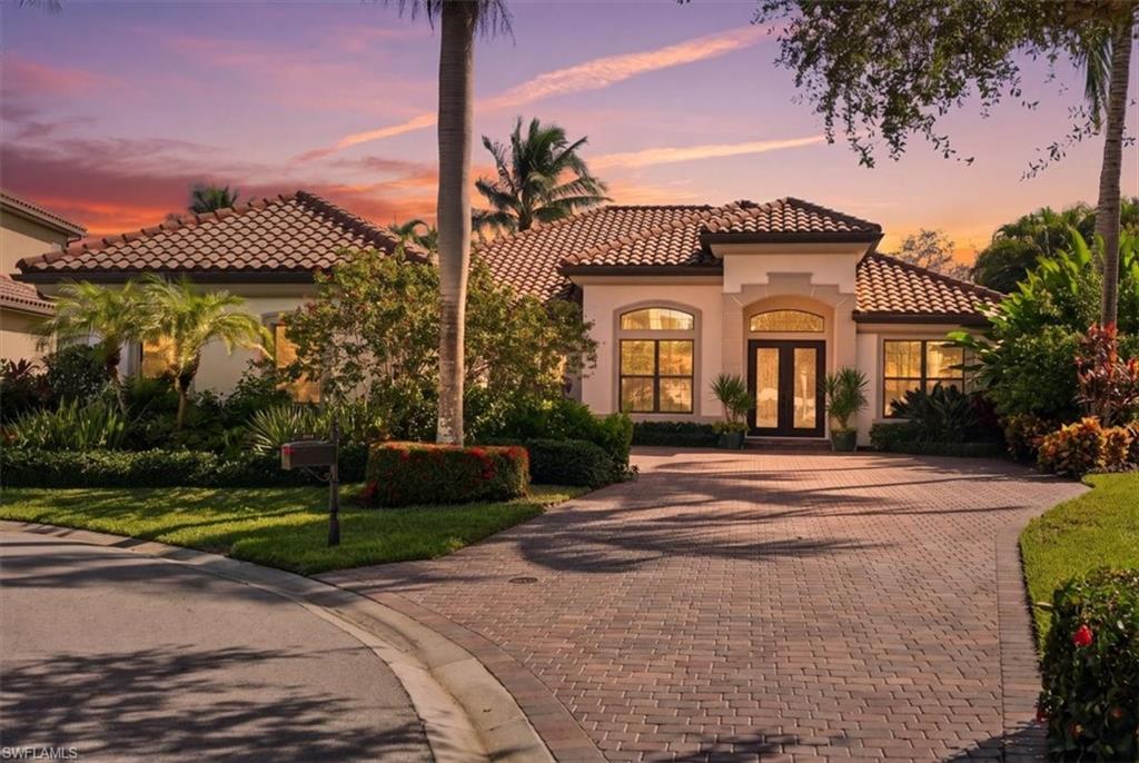 Beautifully appointed and meticulously maintained, this furnished residence offers refined interiors, extensive upgrades, and a coveted FULL GOLF MEMBERSHIP AT THE MEMBERS CLUB AT MARCO, with golf at The Rookery and Hammock Bay and access to the JW Marriott Beach Club on Marco Island.

Situated on a premium oversized cul-de-sac lot, the home enjoys exceptional privacy and spectacular lake views of the 10th hole of Fiddlers Creek golf—a setting that stands apart even among higher-priced new construction in Fiddler's Creek. The open floor plan features three en-suite bedrooms, a den, and a three-car garage. Interior details include chiseled-edge marble flooring, designer furnishings, plantation shutters, custom window treatments, crown molding, and tray and coffered ceilings. The updated kitchen offers Cambria quartz countertops and backsplash, new GE appliances, additional cabinetry, and a custom pantry. The formal dining room includes a bar with a Uline 28-bottle wine refrigerator.

The den features a coffered ceiling, built-in bookcase, credenza, rich wood flooring, and a California Closet system with a safe. The owner's retreat includes a seating area, new flooring, designer window treatments, lanai access, and two walk-in closets. The primary bath offers marble tile, dual sinks, a soaking tub, and a walk-in shower. Two guest suites feature private baths and California Closets, with one bath providing lanai access.

The extended lanai showcases lake and golf views, a saltwater pool and spa with a water feature, updated bar seating six, and an outdoor kitchen with a grill, hood, and refrigerator. Outdoor dining, two televisions, and decorative landscape lighting complete this inviting entertaining space.

The air-conditioned three-car garage, the ultimate man-cave, includes Gladiator organization with a coordinating refrigerator, extensive shelving, ceiling fans, epoxy flooring, insulated doors, and insulated attic storage with pull-down stairs.  Additional upgrades include a whole-house gas generator, tankless water heater, Sonos music system, security alarm, impact windows and doors, motorized hurricane shutters, and A/C replacements in 2024 and 2019.

Fiddler's Creek is a distinguished, gated resort community where residents enjoy a 54,000-square-foot Club & Spa, resort-style swimming pools, fitness facilities, spa services, tennis, pickleball, bocce, casual and fine dining, and an active social calendar. Ideally located between downtown Naples and Marco Island, the community offers convenient access to the Gulf beaches, boating, shopping, and the renowned restaurants and boutiques of Fifth Avenue South.

The transferable full golf membership to The Members Club at Marco offers privileges at The Rookery and Hammock Bay, plus access to the private JW Marriott Marco Island beach club. A rare opportunity to enjoy an exceptional home, spectacular views, and two distinguished golf courses without the customary membership waitlist.