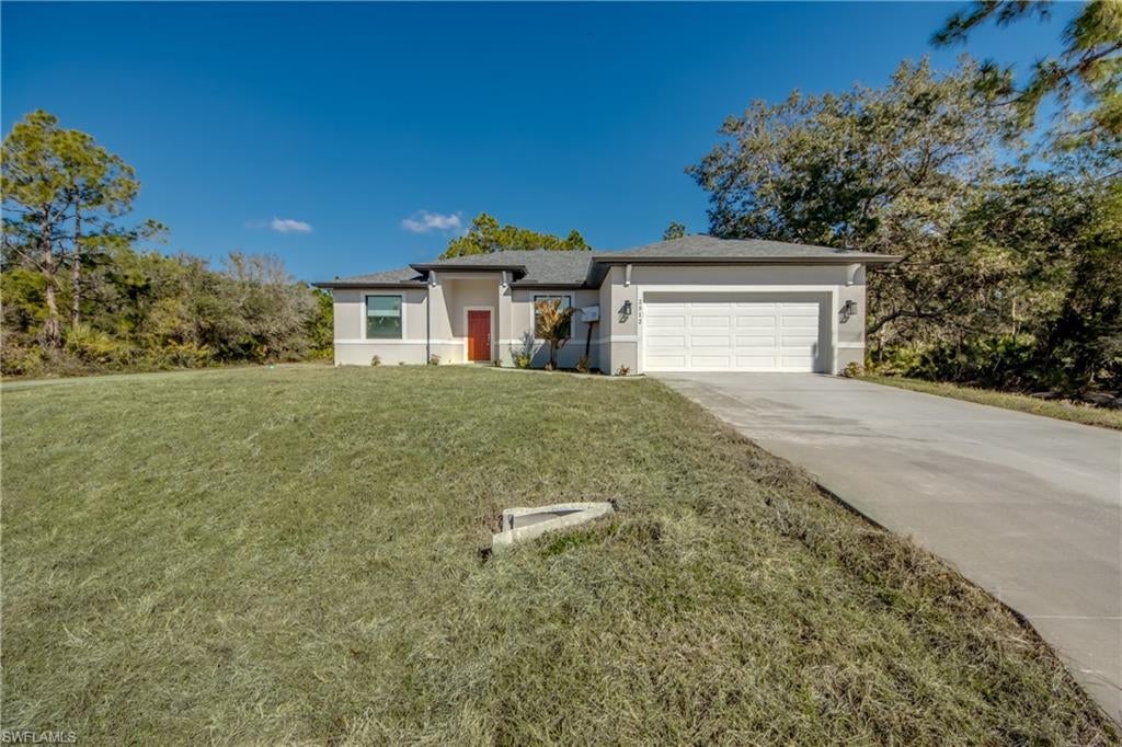This “SEABASS” model is a fully completed, move-in ready residence offering exceptional craftsmanship, thoughtful design, and high-quality upgrades throughout. Built for both style and durability, this home features 100% custom tile flooring, 9’ ceilings, and hurricane-impact windows for added security and peace of mind.

The open-concept floor plan showcases an inviting entry foyer and desirable split-bedroom layout. The kitchen serves as the centerpiece of the home, featuring solid wood soft-close cabinetry, quartz countertops, a full-height pantry cabinet, a stainless steel appliance package, and an oversized island with snack bar seating. A separate formal dining area provides additional space for entertaining.

The spacious primary suite includes a large walk-in closet, dual sinks with matching solid wood vanities, and a beautifully tiled walk-in shower. Secondary bedrooms are generously sized, and all bathrooms feature custom tile work and quartz surfaces.

Enjoy outdoor living on the covered lanai overlooking the yard. Additional conveniences include a washer and dryer, garage door opener, and garbage disposal — with upgrades already included.
A rare opportunity to own a quality-built home where the upgrades are standard, not extra.
