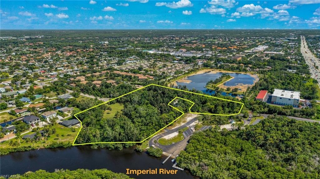 Fully entitled and shovel-ready prime development opportunity in Bonita Springs offering approximately 6 acres with 173 feet of water frontage along the Imperial River. The property is fully approved for 10 estate sized single-family homesites and offers seven private boat docks with access to the gulf. This unique riverfront property provides an excellent opportunity for a residential development project or the possibility of creating a private compound in a desirable Southwest Florida location close to the beach and area amenities should you decide to forego the fully approved development order. Imagine the possibilities, freedom and playground that could be brought to life here. The riverfront setting and generous acreage provide exceptional potential for future development, with convenient access to major roadways, including US 41 (Tamiami Trail), Interstate 75 as well as numerous nearby shopping, dining and entertainment options. Several pristine beaches are within a few miles of this site including Bonita Beach, Barefoot Beach, Fort Myers Beach and Vanderbilt Beach. Could the location be any better......a mile or two from Naples, 30 minutes to Sanibel/Captiva, next door to the Imperial River Boat Launch and fifteen minutes to RSW Airport to mention a few. Deed restrictions, development plans, surveys and all other involved documents are available with a signed confidentiality agreement. The property is currently being offered as a complete development plan until final contractors are chosen to go vertical. From then on, individual homesites will be ready for you to create your dream home. Luxury meets location in one of the last remaining larger parcels right off US 41 in Bonita Springs. Again to reiterate all approvals are in place including but not limited to US Army Corp Of Engineers, South Florida Water Management District, Bonita Springs Utilities and City of Bonita Springs.