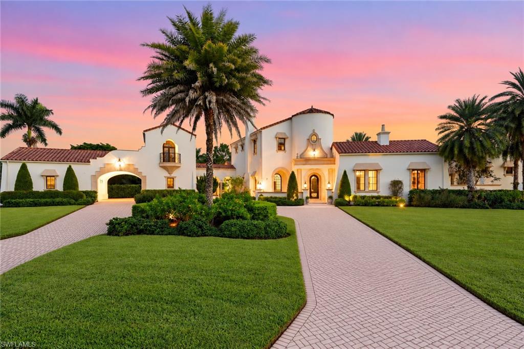 Welcome home to 9546 Via Lago Way, located in the Via Lago neighborhood of Renaissance! This luxurious Spanish-inspired lakefront estate sits on an oversized .67-acre corner homesite with tropical landscaping and year-round sunset views. The home has been thoughtfully redesigned while preserving its distinctive architecture. Newly installed wide-plank white oak flooring, soaring ceilings, exposed beams, archways, expansive windows and French doors bring in natural light and connect the interior living spaces to the outdoors. The fully renovated kitchen features custom cabinetry, quartz countertops, an oversized waterfall island, Sub-Zero refrigerator, Wolf range, designer lighting and a custom walk-in butler’s pantry. The residence offers four bedrooms plus a den, four en-suite baths and two half baths. The primary suite provides a private retreat, complemented by a nearby office and library. Upstairs, two en-suite bedrooms open to private balconies overlooking the outdoor living areas. A detached cabana with a private entrance provides additional space and privacy for guests. A private courtyard surrounds the pool and spa, while the covered outdoor living area features a full summer kitchen, fireplace, wood-plank ceiling and arched openings overlooking the lake. Residents of Renaissance enjoy a premier lifestyle centered around the Arthur Hills Championship Golf Course, with golf memberships available immediately. Community amenities include a resort-style pool and pavilion, full-service spa and fitness center, six red clay tennis courts, pickleball, bocce and a vibrant social calendar.