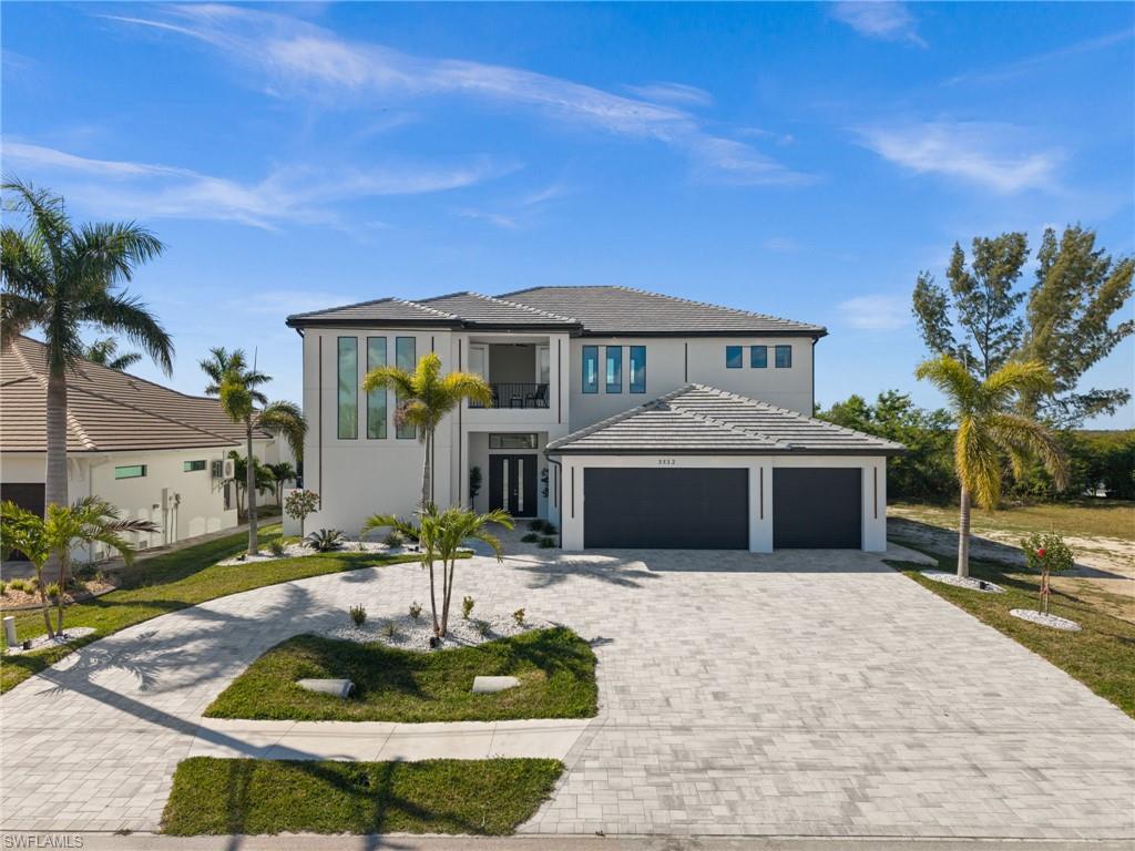 NEW CONSTRUCTION, BRIDGE-FREE GULF ACCESS , PROTECTED PRESERVE VIEWS , 5 EN-SUITE BEDROOMS, POOL, SPA & OUTDOOR KITCHEN

Tucked into one of Cape Coral's most peaceful neighborhoods on the Spreader Canal, this brand-new waterfront home brings together privacy, quality construction, and true boating freedom, all in a setting that feels miles away from everyday life.

Boaters, this is the one. With no bridges between your dock and open water, you can run straight out to Sanibel, Boca Grande, and Cayo Costa with room for a serious boat. It's the Southwest Florida boating lifestyle, right from your own backyard.

Step outside and the lanai steals the show. You get an oversized pool and spa, fire features facing the Spreader Canal, and a fully equipped outdoor kitchen made for entertaining. Across the water sits a protected mangrove preserve, so there are no rear neighbors, just open sky, west-facing sunsets, and sweeping views toward Pine Island.

Inside, the two-story layout offers 5 bedrooms, and each one is a private suite with its own bathroom. That works beautifully for multi-generational living, visiting guests, or a high-performing vacation rental. Two primary suites add rare flexibility: one on the ground floor with water views, and a second upstairs for extra privacy. A dedicated office, a chef's kitchen open to the main living areas, and an upstairs game room complete the plan, while a second-story observation deck serves up panoramic views across the water.

The 3-car garage has plenty of space for vehicles, toys, and storage. Whether you're after a full-time residence, a seasonal getaway, or a vacation rental investment, this home adapts to the way you want to live.

You're close to some of Cape Coral's favorite restaurants and just minutes from Sands Park, with pickleball and tennis courts right around the corner.

Bridge-free boating, preserve views, sunset skies, and a brand-new home built to enjoy it all. This is coastal Florida living at its best.