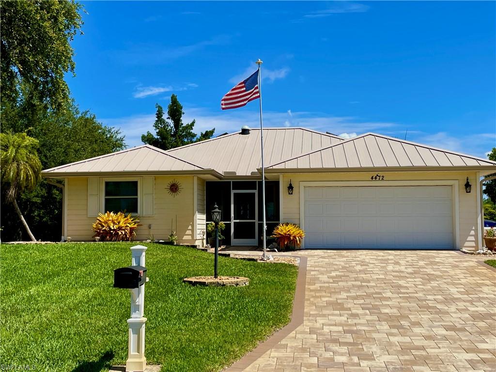 Tired of South Florida's high home prices and traffic snarls? Relocate to bucolic Pine Island on Florida's Southwest Coast. Take a step back into Old Florida amidst soaring pine trees, hiking trails, spectacular sunsets, mango groves, and palm farms. This quiet, peaceful home offers lovely pastoral views on two sides, making you feel like you are in the middle of the country with unrestricted views of local farmland and cows. It is a true nature lover's paradise with more backyard birds than you will find on an Audubon walk. Yet, you are just moments away from a vibrant live music and art scene, great fishing, birding, boating, and ferry service to surrounding barrier islands. Set on 0.27 acres, this 1,500-square-foot property sits in a friendly neighborhood of about 40 homes with a low HOA. Residents enjoy amenities like a basketball court and a community pool that was recently improved.

Virtually everything inside and out has been remodeled since 2018. The home features a two-bedroom, two-bathroom split floor plan that feels almost like having two primary suites, plus an ample den that could serve as a third bedroom while still leaving room for a study. The open layout boasts neutral interior paint, tile floors, and LED lighting throughout. The new kitchen and bathrooms showcase custom cabinetry, a large pantry, and tall, low-water-use toilets. An electric fireplace was recently added to the living room, which also benefits from a natural solar light. Solid core doors and ceiling fans in every room enhance the comfort of the home. The den, with large impact windows, functions as an extension of the main living space and is currently set up with two desk spaces, making it ideal for remote work. Even the garage is heated and air-conditioned, featuring custom cabinets and abundant inside storage.

This home is built like a fortress when it comes to hurricanes, offering absolute peace of mind. Situated on one of the highest points on the island, it requires no flood insurance and experienced no flooding during recent storms. It is equipped with a new metal roof, hurricane-resistant windows, and a whole-house generator. Energy efficiency is a priority, resulting in low electric bills and low A/C costs. The exterior is designed for low-maintenance living, featuring a drought-resistant Provista grass lawn and an irrigation sprinkler system hooked up to a private well. Additional upgrades include covered and open patios, Leaf Filter gutters with buried drains, an antenna in the attic, an outside storage shed for garden supplies, and rainwater storage for inside plants.