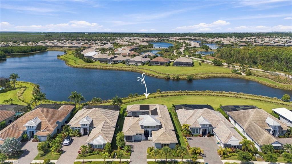 Experience exceptional Florida resort-style living in this pristine 2021-built home on a rare double waterfront lot along Cypress Waterway! This 3,200 SF residence offers 3 bedrooms plus den, 3.5 baths, a 3-car garage and detached guest casita. Soaring ceilings and 10-foot disappearing sliders create seamless indoor-outdoor living. Enjoy a solar-heated pool and spa, expansive lanai, chef's outdoor kitchen, panoramic no-see-um screens and spectacular sunsets. Wide-plank white oak floors flow throughout. The gourmet kitchen features an oversized quartz island, high-end appliances and walk-in pantry. The primary suite offers a spa-like bath and dual custom closets. The office boasts an 18-foot tray ceiling. Impact glass, remote hurricane shutters, custom millwork, whole-house water filtration, central vac and garage storage add comfort and convenience. Isles of Collier Preserve offers a clubhouse, resort and lap pools, 14 pickleball and 6 tennis courts, state-of-the-art fitness center, waterfront dining, bocce, dog park, trails, kayaking and paddleboarding. Minutes to 5th Avenue, Hamilton Harbor, Botanical Gardens and beaches. Don't miss this rare waterfront opportunity! Flood Zone X.