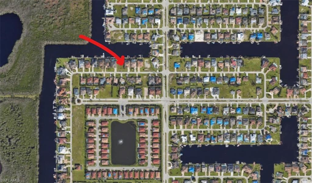 Build your dream home on this oversized 80' x 151' Gulf-access lot, complete with a seawall and no bridges or locks to navigate. Nestled on a quiet street just north of Cape Coral Parkway, this prime location offers stunning water views of the expansive 200' wide Messina Canal, which connects to the scenic Spreader Canal. Surrounded by beautiful homes, this property combines privacy, convenience, and direct boating access.