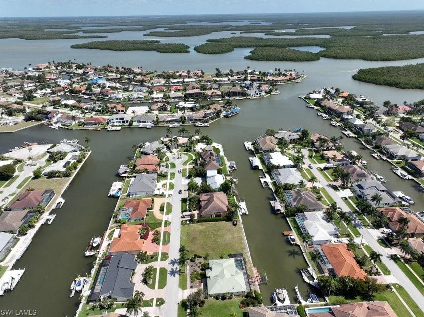 Build your dream waterfront residence on this exceptional water-direct homesite in Marco Island’s desirable River District. Measuring 100 x 110 feet and featuring a newly updated seawall, this property is ready for your vision. Southeast rear exposure welcomes beautiful morning sunrises and refreshing coastal breezes, while the quiet, upscale street offers a sense of privacy and exclusivity. Custom architectural plans for a luxury residence are included, providing an exciting head start on creating your ideal island retreat in one of Marco Island’s most sought-after locations.