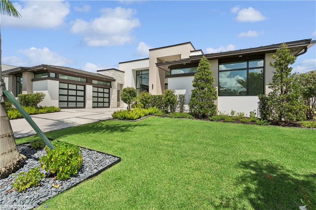 This beauty is ready to move in! Come take a peek! Tour the #1 Community in the USA – Miromar Lakes Beach & Gulf club. San Lorenzo one of Miromar’s highly distinguished communities, is now offering The Tesoro built by AR Homes Fort Myers. Is fully furnished!!  Get ready to move into these 4410 square feet of breathtaking living space. A 19-foot Portico greets your guests with Panama style shutters adorn the exterior. Inside pocketing walls of glass offer spectacular water views overlooking the 47x14 infinity edge swimming pool. Entertaining is clearly a priority and seamless with the presence of deck jets, sun shelf, wet bar, outdoor kitchen, fireplace, pool bath, covered cabana, and lanai. Tesoro offers (3) bedrooms, 4.5 bathrooms, great room, den, bonus room, a magnificent VIP Suite, and an abundance of parking with a (3) car garage. Boat doc included. Come take a tour and see it ALL in one luxurious location.