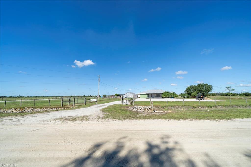 Get away to the Country at this North Fort Myers 3 Acre Paradise. Far enough from the City Hussle and Bussel, but close enough for your Societal needs. This over 2000 Square foot Home under air has 4 bedrooms, 2 baths, formal living room and a Den. Though this well taken care of home is dated, both baths have been re-tiled. The other impressive big, updated features Include a new roof this year 2026, RO water system/2024, Whole home generator with a 500-gallon propane tank/2024, A/C 2021, and a Solar powered 500-gallon fuel tank for diesel or gas your choice. All windows have been updated to energy efficient Double pain Window. Note the only Hurricane rated window is the Huige Formal living room window. There is a 28 X 40-foot shop with two big doors that has a roll up in the back. The shop had a metal reface in 2025. Current Owner had raised Cows, but say the property would suit horse lovers well too. Let's not forget about Chickens and Gardening also..... Home is being sold Turnkey except for personnel Items