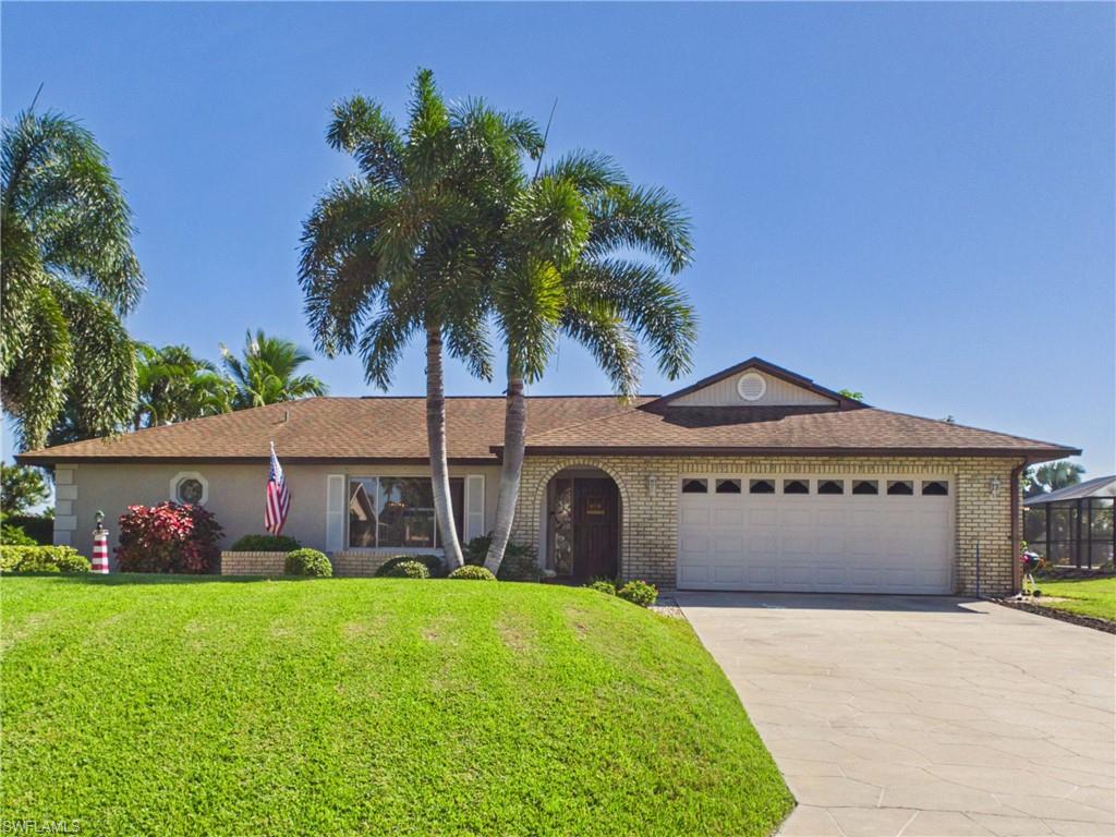 Panoramic lake views, solar efficiency, and a private poolside oasis—this is Florida living done right. Perfectly positioned to showcase breathtaking, unobstructed water views through a picture-window pool cage, this property offers an exceptional blend of comfortable indoor living and outdoor entertaining. The heart of the home features a bright, tiled open space where sliding glass doors connect the main living area directly to an expansive covered lanai, a newly surfaced pool deck and a convenient pool bath. The kitchen boasts a tray ceiling with custom lighting, warm wood cabinetry, a breakfast bar, and a pass-through window to the lanai for seamless hosting. Complete with a private primary suite featuring a walk-in closet, a tranquil backyard with fruit trees and a tropical garden, plus valuable updates like roof-mounted solar panels, a new electrical panel, and a new garage door opener, this move-in-ready home offers comfort, convenience, and energy-conscious living. 

Located in the desirable Riverbend community, the property is conveniently close to everyday essentials, including ALDI and Publix for grocery shopping, as well as nearby dining options like Subway and local restaurants. Shopping centers such as Shoreline Shoppes and Bayshore Center provide additional convenience, while the surrounding North Fort Myers area offers access to parks, recreation, and other local amenities. Enjoy the perfect balance of peaceful waterfront living and convenient access to everyday necessities.