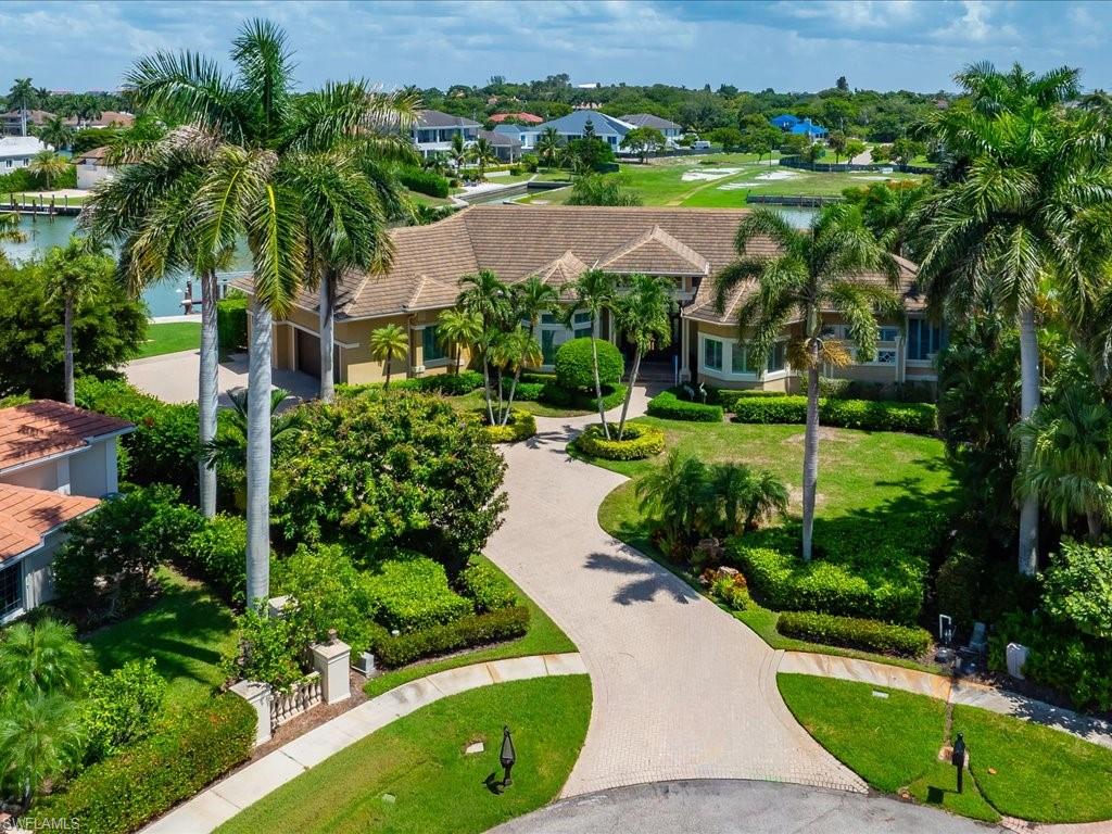 WOW!  LOOK AT THIS SPRAWLING RANCH POSITIONED ON A OVERSIZED LOT BOOSTING APPROXIMATELY 270 FEET OF DIRECT ACCESS WATER FRONTAGE.  THIS ISLAND RETREAT IS LOCATED IN THE ESTATE SECTION OF MARCO ISLAND ON THE DISTINGUISHED HEIGHTS COURT.  THE ESTATE IS TUCKED AWAY DEEP ON THE LOT OFFERING A NICE FRONT YARD PROVIDING LUSH PRIVACY.  THIS PRIVATE SECLUDED RESORT STYLE RESIDENCE IS LOCATED AT THE END OF THE COURT ON A TIP LOT OFFERING ENORMOUS WATER FRONTAGE AND WATER VIEWS WITH TROPICAL SPLENDOR.  THIS PINNACLE OF LUXURY SHOWCASES A LARGE OPEN LIVING AREA, SPACIOUS LANAI WITH AN INFINITY EDGE POOL, SPRAWLING COVERED AREA PERFECT FOR RELAXING, A LARGE AIR CONDITIONED 3 CAR GARAGE, WHOLE HOME GENERATOR, IMPACT GLASS, AND ELECTRIC SHUTTERS, HOTEL INSPIRED PRIMARY SUITE, LARGE GUEST SUITES WITH LANAI ACCESS, A FABULOUS  DEN, AND A CHEF INSPIRED KITCHEN PERFECTLY DESIGNED FOR ENTERTAINING.  THIS HOME WAS PROFESSIONALLY DECORATED, AND IS BEING OFFERED FULLY FURNISHED, AND READY TO MOVE IN.  SCHEDULE YOUR PRIVATE SHOWING TODAY AND SEE WHAT ONLY A FEW CAN CALL THEIR "MARCO ISLAND SANCTUARY".
