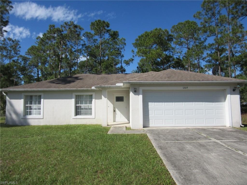Spacious home situated on an oversized lot in Lehigh Acres! This property offers great potential for someone looking to finish and customize the interior to their own style. The home features an open layout with ample living space and room for future improvements. Interior construction is incomplete—kitchen, bathrooms, and flooring are needed—providing a blank canvas for investors or buyers seeking a renovation project. There are new cabinets in the kitchen area. Conveniently located near local amenities, schools, and main roadways. Don’t miss this opportunity to create your dream home or next investment property!