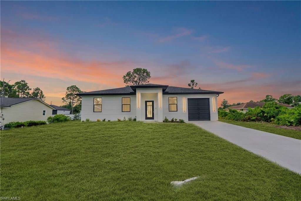 Perfect starter home! This brand-new 3-bedroom, 2-bath home offers ample space with a bright, modern design that makes great use of every square foot. The open-concept living and kitchen area features tile flooring throughout, quartz countertops, a large center island, stainless steel appliances, modern white cabinetry, black hardware, pendant lighting, and recessed lighting. Black-framed windows and doors add a clean, contemporary contrast, while both bathrooms feature beautifully tiled walk-in showers and modern finishes. Sliding glass doors open to the backyard, giving you plenty of room to create your own outdoor space. Modern, affordable, and move-in ready, this is an excellent opportunity for a first-time homebuyer looking to own instead of rent in Lehigh Acres.