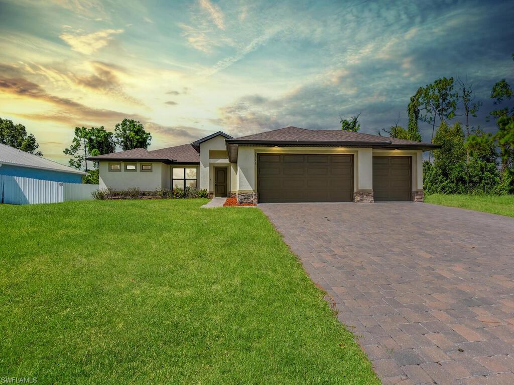 Custom built by Douglas Brooke Homes. This 2022 home is ready for your family today! NO HOA PAYMENT. This desirable floor plan offers 4 beds, 2 baths, a 3-car garage, and a spacious lanai. The 1800+ ft home is a true open floor plan featuring an open view from the kitchen area to the great room and dining area, perfect for entertaining guests. The kitchen boasts real wood cabinets, a breakfast bar island, and stainless-steel appliances. High-end finishes include high ceilings, granite countertops throughout the home, porcelain tile flooring throughout the home.  On one side of the home, the owner's private suite is highlighted with a walk-in closet, a large shower, and dual sinks in the En-Suite. Three extra beds and a bath complete the opposite side of the home. The spacious 3-car garage and oversized extended paver driveway only add to the charm of this home. Easy to commute to restaurants, shopping, hospitals, and nightlife. This is a great opportunity, do not miss out on it!