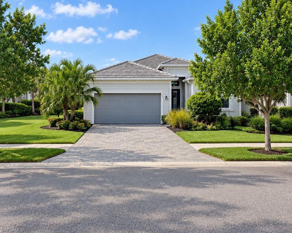 OFFERED FULLY FURNISHED! EIGHT PICKLEBALL COURTS & BUNDLED GOLF INCLUDED - SOUTHWEST REAR EXPOSURE  Welcome to luxury living in the highly sought-after National Golf and Country Club at Ave Maria! This highly sought after Maria model home offers 3 bedrooms + den, 3 full bathrooms, 2,246 square feet of beautifully designed living space AND FURNISHED!. Bring your suitcase and immediately enjoy an open floor plan with tile throughout, crown molding, and an abundance of natural light. The spacious kitchen opens to the dining area and provides picturesque views of the covered lanai, which features a heated pool and spa—perfect for entertaining family and friends. Step outside to your outdoor summer kitchen and take advantage of the true Florida lifestyle. The split floor plan offers the primary suite its own retreat with a tray ceiling, two walk-in closets with an oversized shower. Private access to the lanai adds an extra layer of luxury. Three additional well-sized bedrooms are perfect for guests or family. Relax while watching incredible sunset views from your lanai and pool overlooking the lake and putting green of the 11th hole. Enjoy the exclusive benefits of a bundled golf membership to the National Golf & Country Club, featuring an 18-hole course designed by Gordon Lewis, a clubhouse, and premium amenities. This is an unparalleled opportunity to own a piece of paradise in Ave Maria. Don’t miss it!