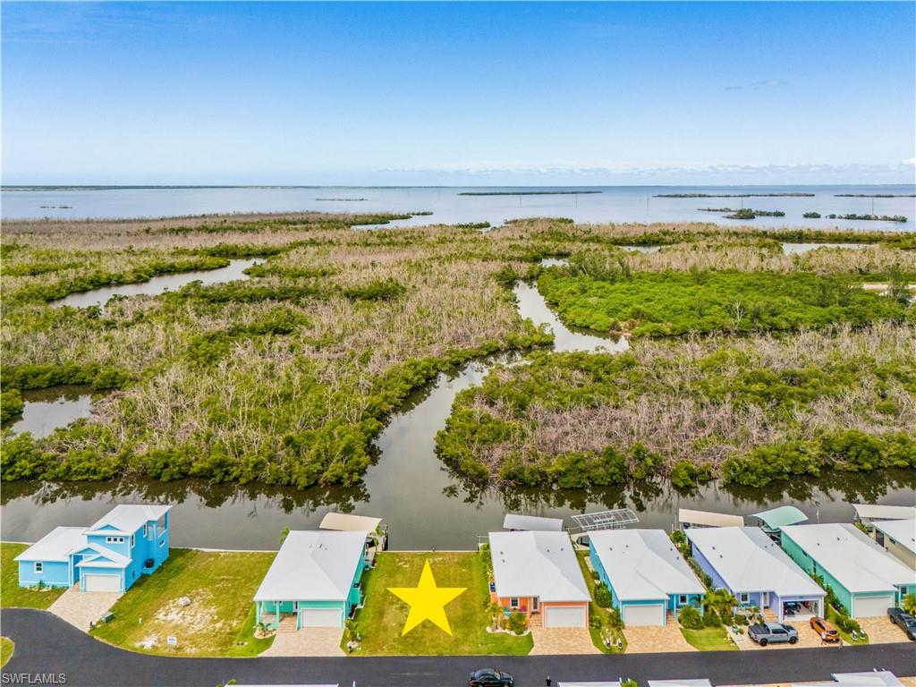 Discover Treasure Cove, Pine Island’s newest waterfront community, with fast, deep-water access to San Carlos Bay and the Gulf of Mexico. Designed with boaters in mind, Treasure Cove offers an exceptional location for fishing, cruising, and enjoying the Southwest Florida waterfront lifestyle. YOU MUST CHECK OUT THE VIDEO FLYOVER IN THE VIRTUAL TOUR. The community features low HOA fees, central water and sewer, and new homes built to today’s elevation standards to help reduce flood risk. Choose a complete home-and-lot package or purchase your waterfront homesite separately and build when you’re ready—there is no required timeline to begin construction. All home plans are subject to HOA approval. Secure your place in this new Pine Island waterfront community and start planning the home—and boating lifestyle—you’ve been waiting for.