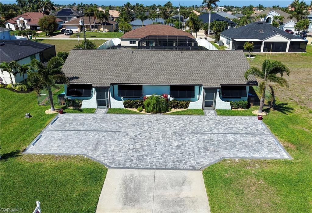 Furnished Annual Rental Duplex Can be rented Short Term for $3500 or annual at $1999 This completely remodeled modern duplex home in Cape Coral, FL offers a fresh, contemporary living space with all wood flooring throughout. The property is pet friendly and includes access to a shared heated pool for seasonal enjoyment. Clean lines, updated finishes, and an open layout create a comfortable, move-in-ready environment for those seeking a modern aesthetic in a desirable Florida location. Furnished Lawn care Included