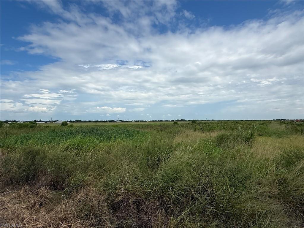 11.17 +/- acres located on 3rd Road, Gerber Groves Section 2, surrounded by groves, farms, and pastures. This property is zoned Ag-2, which also allows for residential use. It has been cleared and has drip irrigation and includes the pump as well as a new (uninstalled) pump, that is not currently on site.  There’s a new concrete slab at the southeast corner. The canal at the south end of the property is available for irrigation and serves as a natural border to the property. Besides citrus, there are many small farms in the area growing row crops and tropical fruit (lychee, mango, dragon fruit, passion fruit, etc.). There’s a variety of livestock in the surrounding area, including cattle, sheep, goats and ostriches. The owner purchased fence posts to fence the entire property. They are currently not on site but will be included if buyer wants them. Approximately 1 hour from RSW and 45 minutes from I-75 to Miami via SR 29 in Immokalee or northbound via SR 80 in Fort Myers. Property is in the Gerber Water District and subject to the Water District tax which is collected by the Hendry County Tax Collector and is used to maintain the roads, canals, and employ security. The roads are private and monitored by a security guard to prevent trespassing.