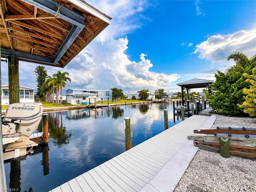 Picture it…. waking up to another beautiful Southwest Florida morning. The sun is shining, the fish are biting, and the laid-back island lifestyle of St. James City is all around you. At 2708 Sanderling Court, we call that Tuesday.
This elevated three-bedroom, two-bath waterfront home offers 1,433 square feet of living space, room for family and guests, a private pool, and the boating access that makes this community special. From your dock, reach open water in less than 15 minutes—with direct Gulf access!! Spend your mornings fishing, afternoons relaxing by the pool, and evenings exploring St. James City's in your golf cart visiting waterfront restaurants and enjoying live music.
Inside, huge ceilings, wood floors, and an open living area make it easy to gather after a day on the water. The home features a split bedroom floor plan with screened in balconies on the front and back of the home. On the lower level, there is enclosed bonus storage and workshop space providing additional room for fishing gear, tools, and projects.
Whether you're escaping winter or settling into island life year-round, there's room here to enjoy the best of Southwest Florida. Bring your boat, your fishing rods, and your flip-flops.