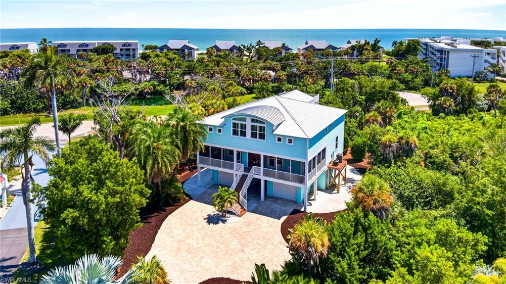 On Sanibel, the best days often begin and end near the water. In Butterknife, that rhythm comes with a level of privacy and convenience found nowhere else along West Gulf Drive. The only gated community on this desired island corridor, Butterknife is a private enclave of just 34 homesites, with gated streets, and deeded beach access for pedestrians and golf carts. Approximately 344 feet from the community's deeded beach access, this turnkey-furnished beach house offers 3,634 square feet of air-conditioned living space with five bedrooms and three full baths. Built in 2015 by Seacoast Cottage Company, the residence captures a relaxed coastal character through bamboo plank accents along vaulted ceilings, generous gathering spaces and an elevator connecting all three levels. Above it all, a rooftop observation deck creates a private perch for Gulf views and the changing colors of the Sanibel sky. The kitchen is designed for everything from mornings after a beach walk to evenings spent entertaining, with custom-stained cabinetry, a walk-in pantry, farmhouse sink, wine cooler, KitchenAid appliances, cooktop and microwave drawer. The home is offered turnkey furnished, including a fully equipped kitchen, making the transition to island living refreshingly simple. Recent improvements add another layer of value. A standing-seam metal roof, irrigation system and hurricane-rated garage doors were added in 2023. Hurricane-rated windows and doors complement the home's Hardie board exterior. The setting extends the lifestyle well beyond the residence. Butterknife's newly completed sports and fitness facility features tennis, multiple pickleball courts, a sports and basketball court, and a shaded observation area with seating. The community pool is approximately 111 feet from the property. For those who envision a private pool, the property's 10,000 square feet of allowable impervious and developed-area coverage provides room for that possibility, subject to applicable approvals. There is also a compelling replacement-cost perspective. Based on an estimated $400,000 homesite value and approximately $1.8 million to construct a 3,634-square-foot residence, or about $495 per square foot, the estimated replacement basis is at least $2.2 million. Here, the appeal is as much about what is in place as what surrounds it, including a furnished beach house, gated island setting, recreation just outside the door and the Gulf only a short distance or golf cart ride down a private community path.
