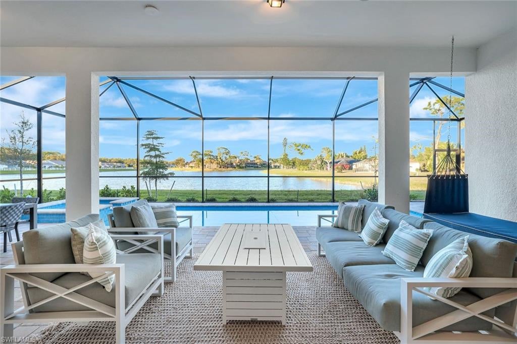 Exceptional value meets impeccable design in this standout Southwest Florida residence. With professionally designed high-end upgrades, an unforgettable waterfront view, and a prime location just minutes from the beach, Naples, and the Fort Myers International Airport (RSW), this home offers a level of luxury and convenience rarely found at this price. Opportunities like this are few—and they never last long. Welcome to 10112 Seaside Way—a beautifully curated sanctuary offering 3 bedrooms + den, 3 full baths, 3-car garage, and negotiable turnkey furnishings. Perfectly positioned on a premium waterfront lot outside the flood zone, the home’s signature pocket sliders showcase serene lake views, a sparkling pool, relaxing spa, sun shelf, and generous space to design your dream outdoor kitchen, dining, and lounging areas—ideally positioned to savor Florida’s painted-sky sunsets. Inside, the layout is as functional as it is comfortable, while a dramatic formal dining room creates an inviting setting for memorable gatherings, seamlessly connecting to the living room with soaring tray ceilings. Its chef-inspired kitchen is complete with gas cooktop, custom tile backsplash, 42” cabinetry with crown molding, roll-out trays, a spacious walk-in pantry (practically its own room), and a customizable breakfast nook. A natural gas system powers the 5-burner cooktop, pool + spa heater, water heater, & clothing dryer—bringing both efficiency and savings. The owner’s suite is a private haven featuring the water views that make this home so special, a spa-style shower, and an expansive dual-entry walk-in closet. Guests enjoy a private ensuite bedroom on the opposite side of the home. Complete with impact-resistant windows+doors, it offers peace of mind, while the low HOA dues—only $800 per quarter—include lawn care & irrigation, giving you more time to fully appreciate Southwest Florida living. Additionally, fences are permitted, allowing you to create a secure outdoor space for children, pets, or added privacy. Experience the vibrant character Bonita Springs is known for: minutes from award-winning beaches and the up-and-coming downtown area where residents enjoy dining, shopping, and entertainment that blends coastal charm with small-town warmth. Spend your days kayaking the Imperial River, exploring the family-friendly food truck park, listening to live music at the Sugar Shack, & celebrating the holidays with community events at Riverside Park. Even your four-legged family members have their own gathering spot at the Bonita Springs Dog Park. Families will also appreciate the convenience of nearby schools that support an active, well-connected community. Combining elevated finishes, a tranquil waterfront backdrop, and effortless ownership, this home allows you to embrace the life you’ve envisioned. With an optional turnkey package, moving in becomes even easier—an opportunity to begin enjoying the Florida lifestyle right away.