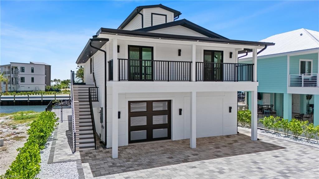 Unmatched Waterfront Living in the Heart of Fort Myers Beach! Step into coastal elegance with this stunning GULF ACCESS POOL home, perfectly positioned on one of the most desirable Bay-Canal locations. LOCATION, LOCATION, LOCATION! Set in the vibrant Pier District, you’re within walking distance to top destinations like Margaritaville, Yucatan, Wahoo Willie’s, Snug Harbor, and other beloved restaurants, bars, and boutiques. BOATERS DREAM - Boat-in to a dozen restaurants & bars in minutes. Designed for both relaxation and entertaining, the home features an open-concept kitchen and great room that seamlessly flow together, all highlighted by expansive west-facing water views—ideal for soaking in golden sunsets from your living room. The residence utilizes its well-thought-out floor plan to deliver effortless indoor entertainment that transitions beautifully to the outdoor living space—complete with a swimming pool and spa and a spacious backyard retreat designed for relaxation and gatherings. Enjoy effortless Gulf access from your back yard and explore the sparkling waters of Matanzas Bay at your leisure. Whether you’re cruising out for a day on the water or strolling just minutes to the beach, this location is truly second to none. This home is not only a serene full-time retreat but also an ideal vacation getaway or rental Property—located in a high-demand area that blends coastal charm with exciting redevelopment, including the revitalized Times Square and the proposed Moss Marina transformation. With unmatched water views to the east and sunsets to the west, quick access to the Matanzas Pass Bridge and RSW Airport, and a location that places you at the center of Fort Myers Beach’s future, this is more than just a home—it’s your front-row seat to paradise.