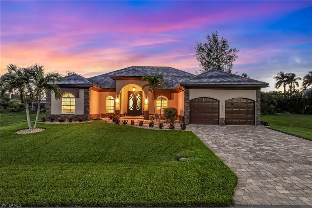 Experience the beauty of Gulf-Access living in this custom waterfront residence in Southwest Cape Coral! Western exposure fills the expansive lanai with afternoon light and sets the stage for gorgeous sunset evenings beside the pool. Beyond the water’s edge, a captain’s walk and 12,000-pound boat lift invite you to make the most of every day on the water!

Offering more than 3,100 square feet, this custom four-bedroom, three-bath home pairs a distinctive layout with timeless, tasteful finishes. A striking new iron front door welcomes you inside, where travertine flooring and quartz countertops create an elegant feel throughout. The generous primary suite offers a peaceful retreat with a soaking tub, separate shower, and dual vanities.

A new flat tile roof installed in 2023, hurricane-impact windows, new pool heater, and a whole-house Culligan water system complete the home. Nestled in a desirable Southwest Cape Coral neighborhood near shopping and dining, it offers an inviting blend of refined interiors and relaxed waterfront living! Schedule your showing today!