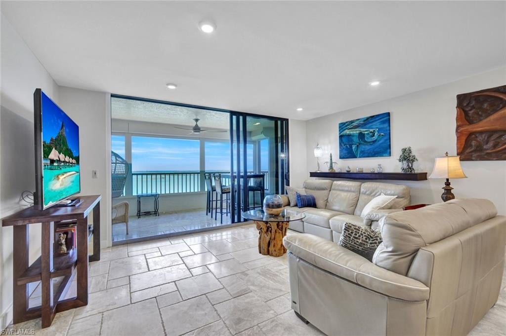 Investment opportunity with 6-month tenant scheduled for November 2026. Discover one of the finest opportunities available at Punta Rassa in the highly sought-after center Bayfront Building. Perched on the 9th-floor penthouse level, this exceptional residence offers a private oasis above the bay with breathtaking panoramic island and sunset views from the screened balcony.
Wake up to beautiful sunrises and sweeping views stretching to Fort Myers Beach from the front of the property, creating a rare balance of sunrise and sunset vistas from this residence.
The condo showcases timeless luxury finishes, including elegant silver travertine marble flooring, a stunning kitchen with Cristallo Quartzite countertops and waterfall edge, a beautifully appointed primary bath featuring dual sinks with Lincoln Calcutta marble countertops, Vanilla Ice marble shower in the primary suite, Guest bathroom with Coral Reef shell stone countertops, Guest shower finished in Corinthian Fossil marble with a custom Wet Dog mural. The residence is offered partially furnished (excluding the dining room and artwork), making it easy to settle in and begin enjoying the coastal lifestyle.
Even better, the seller has paid all assessments in full.
Residents enjoy an array of resort-style amenities and a prime location near the beaches of the Sanibel Causeway, along with nearby dining, tennis, pickleball, a pool, spa, and on-site property management.
The property is also adjacent to the renowned Sanibel Harbour Marriott Resort & Spa and Sanibel Harbour Yacht Club, where residents enjoy complimentary access to the deli, dining venues, and lounge.
With picture-perfect views, luxurious finishes, and an unbeatable location, this extraordinary penthouse opportunity is truly one to experience in person.