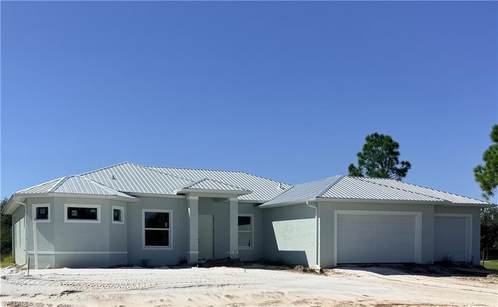 COUNTRY LIVING! BRING YOUR TRUCK! New construction on 1.25 Acres of land in an open area where you can relax and enjoy the night sky without obstruction!  This large home has volume and cathedral ceilings, with plenty of space for the family and entertaining.  Expansive 4-bedroom, 3 baths home has a large great room floor plan, with an additional family room with lots of windows for the country view.  Neutral colors with solid surface counter tops, abundant cabinets for storage including the laundry room.  Enjoy a 3-car garage, aluminum roof, and modern ranch style design.  Plenty of room for a pool with a large backyard space with many possibilities.  Home is still under construction with estimated completion late fall 2026.  Schedule your showing to see this beautiful home.