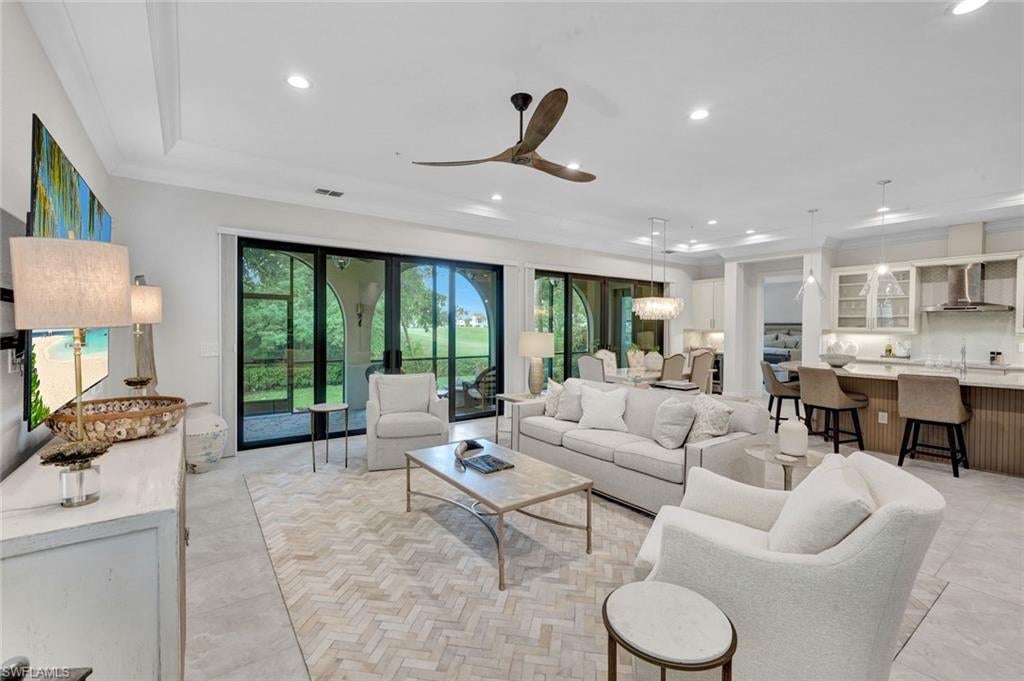 SKIP THE WAITLIST! Windstar on Naples Bay Social Membership is available immediately with this property, offering buyers the opportunity to begin enjoying the Windstar lifestyle without the typical wait.

Experience exceptional Southwest Florida living in this First-floor Coach Home in Regatta Landing, offering 2,348 square feet of spacious living with three Bedrooms, two Baths and an attached two-car Garage. Designed to live like a single-family home, this light-filled residence features a desirable split-bedroom floor plan, high ceilings, and an open-concept layout ideal for everyday living and entertaining.

The spacious kitchen opens seamlessly to the main living and dining areas and features abundant cabinetry, a pantry, double ovens and a wine cooler. Significant upgrades include impact-resistant windows and doors for added peace of mind, along with an A/C system replaced in 2023.

The expansive primary suite is a true private retreat, featuring generous proportions, two custom closets and a spacious primary bath with dual sinks, a soaking tub and oversized separate shower. Two additional bedrooms offer flexibility for guests, family or a home office.

One of the home's standout features is the expansive oversized screened lanai, extending the living space outdoors and showcasing peaceful views across Windstar's beautifully maintained golf course. It's an exceptional setting for morning coffee, alfresco dining, entertaining or simply enjoying the Florida lifestyle.

Residents of Regatta Landing enjoy a stunning private community pool and spa, along with a social grill area beautifully positioned along the waterway, creating an inviting setting to gather, entertain and enjoy Southwest Florida living.

Windstar on Naples Bay offers one of Naples' most distinctive lifestyles, bringing golf, boating and beach living together within one gated community. Residents enjoy access to Windstar's private Keewaydin Island beach with boat transportation aboard the Keewaydin Queen. Optional Club membership opportunities provide access to additional amenities and experiences.

Ideally located just minutes from downtown Naples, Fifth Avenue South, Third Street South, exceptional dining, shopping and Naples' renowned Gulf beaches, this residence presents an outstanding opportunity to enjoy the highly sought-after Windstar on Naples Bay lifestyle. Membership is optional, subject to Club approval, and requires a separate purchase.