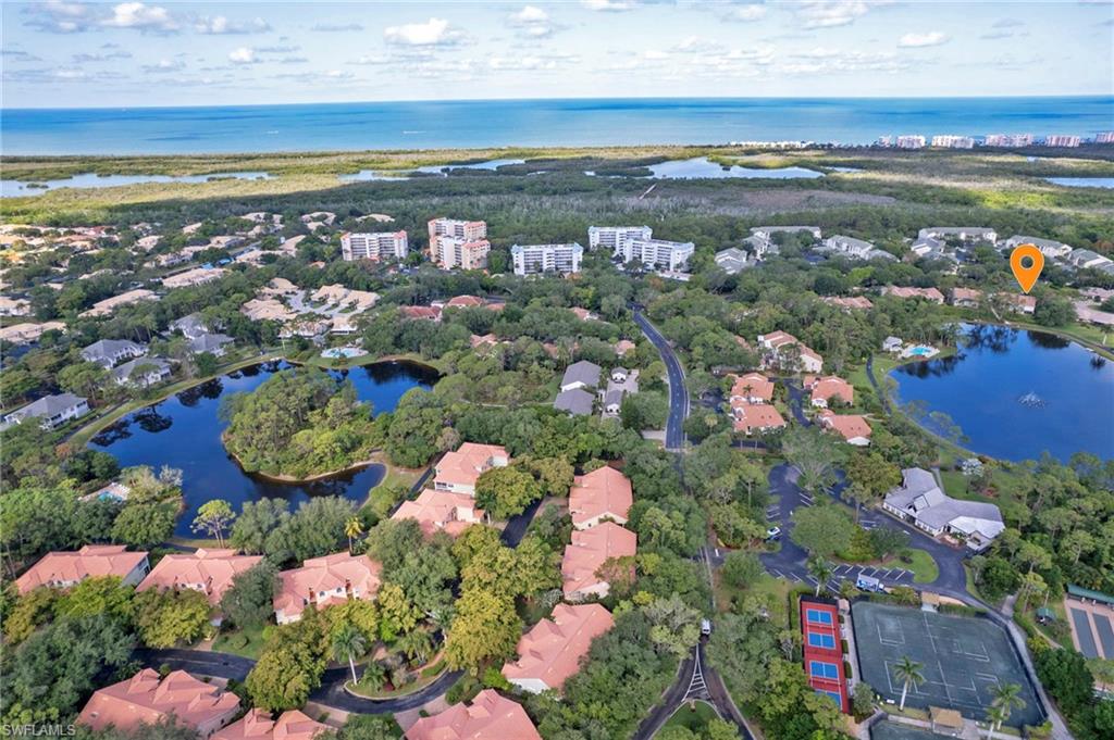 One of the best views in beautiful Bay Forest! Enjoy a gorgeous view of the lake and fountain from your bonus sunroom: the glassed-in lanai, offering extra privacy without infringing on the tranquil ambience. Vaulted ceilings throughout the unit feature skylights in the living area and den, while end-unit windows along the great room and kitchen provide additional natural light, with trees beyond that afford privacy. A screened balcony on the front of the house offers more sun-soaking space. Tile floors, stainless appliances, newer cabinets and vanities, and updated primary tub/shower and guest shower make this move-in ready. The den has room for a pull-out bed and pocket doors for privacy when needed, and the guest room comes with a queen-size Murphy bed to accommodate visitors without giving up every-day usable space. The one-car garage directly in front of the unit is wide enough for storage cabinets and has attic storage, too. Note, too, the owner's artistic touches: the hand-painted sidelight by the upgraded front door, and a mosaic in the kitchen to inspire the Mediterranean chef in you! You'll never want to leave this lovely home! (But if you do, electric hurricane shutters and an alarm system provide extra peace of mind when you're away.)
Bay Forest's beautiful grounds include 2+ miles of paved trails and a fabulous boardwalk through a preserve to the back bay, complete with tiki hut and paddle-sport launch. Fish from the pier, birdwatch, kayak through the mangroves, or just take in the wonder of the sunsets and passing dolphins, all without ever leaving your neighborhood. A fitness center, library, and enviable pickleball, tennis, and bocce courts are just some of the other community-wide amenities. Sandy Pines is located in the heart of Bay Forest, with easy access to the lakeside pool and just a short walk to the clubhouse and courts. This friendly community is close to Barefoot and Delnor-Wiggins beaches, and convenient to North Naples and Bonita Springs shopping and restaurants--a secluded spot in the middle of it all!