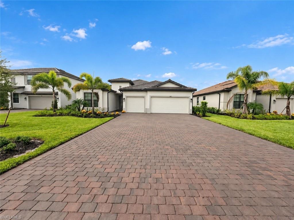 Furnished Summerville pool home with lake views in the gated community of Verdana Village! Built in 2025, this single-story home offers 3 bedrooms plus a den, 3 full bathrooms, and a 3-car garage. The spacious great room and split-bedroom layout provide comfortable everyday living and room to host guests. The kitchen features a large island, gas cooking, and a walk-in pantry, with adjoining dining space for easy entertaining. A separate den offers flexible space for a home office or retreat. The primary suite features two walk-in closets and a bathroom with two separate vanities and a walk-in shower.

Enjoy Florida outdoor living on the screened lanai, where a private heated pool and spa overlook the lake. Tile flooring, tray ceilings, and included furnishings complement this inviting home.

Verdana Village offers an extensive collection of amenities, including indoor and outdoor tennis and pickleball courts, basketball, bocce, fitness facilities, a resort-style pool and spa, and a lap pool. Residents can also enjoy a restaurant, café, craft beer lounge, dog park, and smaller amenity centers on each side of the village. HOA-covered lawn maintenance and irrigation make everyday upkeep easier.