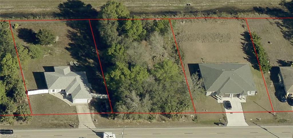 Exceptional Investment Opportunity in Highly Sought-After Buckingham! Discover the possibilities with this generously sized 0.41-acre property, offering outstanding value for investors, builders, or those looking to create their dream home. Featuring beautiful mature oak trees and additional space behind the lot, this property offers a unique opportunity to build a single-family home, a duplex, or potentially two homes, subject to zoning and county approvals. A canal behind the property may provide additional drainage benefits. Conveniently located in the desirable Buckingham community, close to shopping, restaurants, and everyday conveniences. Opportunities like this are hard to find—bring your vision and make it a reality! This exceptional value won't last long!