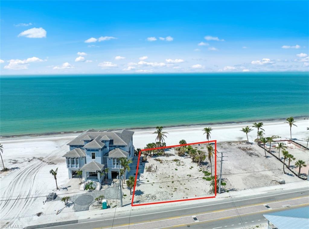 Looking for the ultimate beachfront lifestyle? Look no further than this spectacular oversized lot in the heart of Fort Myers Beach, boasting 90 feet of direct beachfront access and endless possibilities for customization and construction. This oversized 90' wide lot provides ample space for a luxurious custom home. With its prime location in one of the most desirable locations on the beach, this property offers the perfect combination of privacy, tranquility, and convenience. Imagine waking up to the sound of the waves crashing just steps away from your front door, or enjoying stunning sunsets over the Gulf of Mexico from your spacious outdoor living area. Don't miss out on this once-in-a-lifetime opportunity to own an oversized lot with direct beachfront access in Fort Myers Beach. Preliminary custom house plans are available.