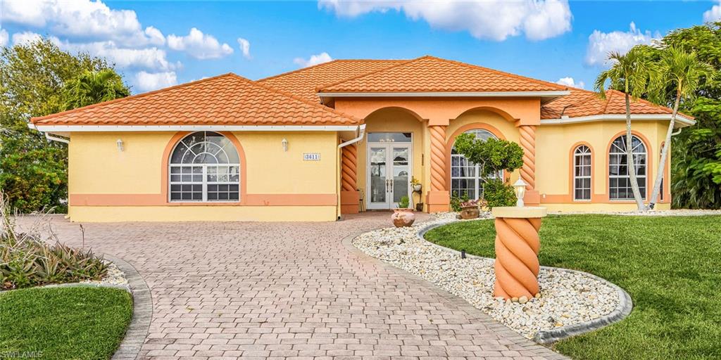 GULF ACCESS – STUNNING INTERSECTING CANAL & BASIN VIEWS! Enjoy breathtaking wide-water views right from your lanai! This one-owner,
well-maintained 3-bedroom, 2-bath Gulf access pool & spa home sits on an oversized lot with 170 ft. of seawall, providing ample space for
boats and water toys. Located on a large canal and basin with gorgeous intersecting views, this property is a boater’s dream. A spacious open
floorplan features multiple pocketing glass sliders that seamlessly blend indoor and outdoor living, opening to an expansive lanai—perfect for
entertaining. The home includes an alarm system, central vacuum, and intercom, offering convenience and comfort. Recent improvements
include a tile-like metal roof (2024) and a new heat pump for the pool and spa. The home has never experienced flood damage from past
storms. Outside, you’ll find a large circular driveway and additional rear parking area by the attached garage, ideal for extra vehicles or storage.
Enjoy Florida living at its best as you relax by the pool and spa, taking in the serene waterfront backdrop. Located in a fast-growing area of new
and upscale homes in NW Cape Coral close to shopping and dining. This spacious property is a must-see—Set up an appointment to view this
home today