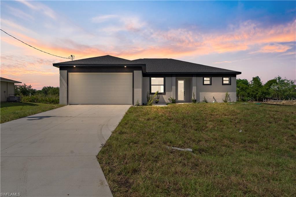 Discover a place that truly feels like home.

Tucked just off Sunshine Blvd N, this brand-new construction offers the perfect balance of modern design, everyday comfort, and room to grow. From the moment you step inside, the space feels open, bright, and inviting—designed for real life, not just first impressions.

This home features 3 bedrooms, 2 full bathrooms, and a versatile den, giving you flexibility for a home office, playroom, guest space, or whatever your lifestyle needs next. The kitchen sits at the heart of the home, complete with stainless steel appliances, ample cabinetry, and a large center island that makes cooking, hosting, and daily living effortless.

The primary suite is a true retreat, offering a spacious layout with dual sinks, a walk-in shower, and sleek modern finishes that bring comfort and calm to your everyday routine. Thoughtful details throughout the home create a space that feels both functional and elevated.

Set in a growing area of Lehigh Acres, you’ll enjoy a sense of privacy while still being conveniently close to major roads, shopping, dining, and everyday essentials.

If you’ve been waiting for a fresh start in a brand-new home that truly makes sense, this one is worth seeing in person. Schedule your private showing today and picture the life you could build here.