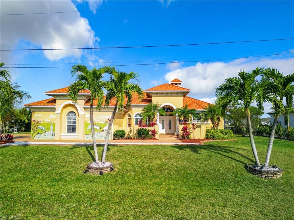 Still time to make this your HOME for the Holidays! Florida Lifestyle at it's best! Almost 3,000Sq Ft of living space under air 4 bedrooms, 2 master suites,plus Guest wing with pool bath. Indoor and out door kitchens to die for , formal dining with wet bar and wine cooler, breakfast nook for less formal eating while overlooking pool and intersecting canals. Large open Foyer giving a quiet sitting area with a great view. Living room has french windows on to sundeck with canal view and easy access to the infinity edge pool with swim up table under tiki cover and stools. The huge pool cage even has a doggie door leading to a large fenced area for your furry family to run free. Outside the extra long paver driveway with extra turning space allows for lots of extra parking. Innovative custom architectural barrel vaulted stone coated steel roof looks like Spanish tile stronger than any other roof, 60 year warranty! Easy to operate electric and manual shutters, safe and secure no matter what the weather brings. With just one bridge to Mattlacha pass and private boat lift with new bright red canopy and captains walk dock you are sure to be able to explore the local sail up restaurants and the many easily accessible islands. Year round or just a getaway place in the sun, the lush landscaping, great layout and amazing outdoor area under screened lanai make this a relaxing piece of Paradise! Come see it for yourself and fall in Love! Just 30 minutes from Punta Gorda Airport 15 minutes to I75 and 45 minutes to RSW airport getting here or to wherever your hearts desires is quick and easy!