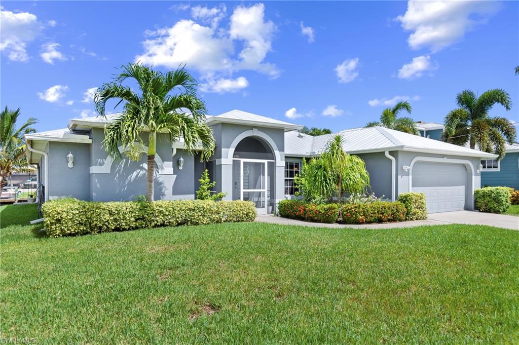 Discover the ultimate Gulf-access waterfront lifestyle in Southwest Florida – world-class boating, tarpon fishing, championship golf, and sugar-sand beaches right at your doorstep.
This hurricane-fortified 4-bed, 2-bath canal front home puts you on the Gulf in minutes from your private captain’s walk dock with 10,000 lb lift. Fish for tarpon and snook off your dock, watch manatees and dolphins play in the canal, or cruise 15–20 minutes to Matlacha Pass, Pine Island Sound, and legendary Boca Grande Pass – the tarpon capital of the world where 200-lb silver kings leap year after year.

Enjoy the saltwater heated pool, oversized screened lanai with hot tub (negotiable), and daily sunrise-to-sunset views with southern exposure.

Storm-ready construction:
*Full impact windows & doors
*New 2023 metal roof
*Accordion shutters on lanai
*Pre-wired for generator (negotiable)
Inside: vaulted ceilings, open great room, updated kitchen with stainless appliances and breakfast bar, split floor plan with spacious primary suite, plus three additional bedrooms (one oversized). Also includes high speed internet, 2-car garage with durable epoxy-finished floor, and no HOA.

Golfers are minutes from top courses; Sanibel, Captiva, and Fort Myers Beach are a quick drive or boat ride away. Miceli’s waterfront dining is a 20-minute cruise from your dock.

This is a hurricane-strong, Gulf-access waterfront estate offering the complete Florida lifestyle – don’t let this rare gem get away!

Elevated construction and prime location have kept this home high and dry – never flooded, not even during Hurricane Ian or any other storm.