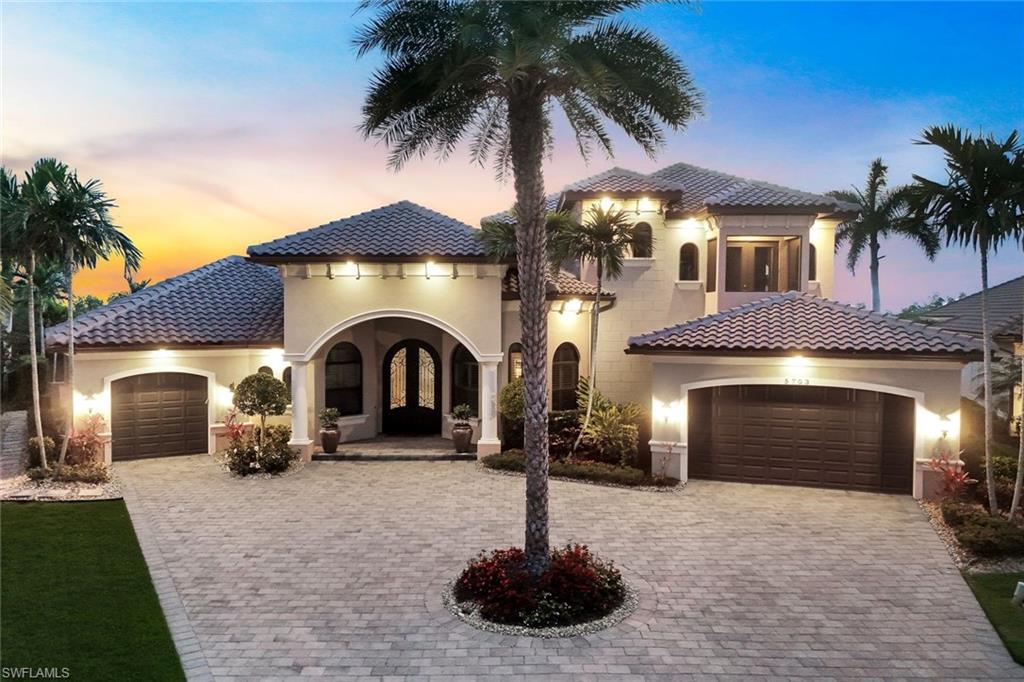 THIS IS THE ONE YOU’VE BEEN WAITING FOR! LOCATION, LOCATION, LOCATION! RARELY AVAILABLE OVERSIZED HOMESITE WITH SOUTHWESTERN REAR EXPOSURE, 180' OF DEEP DIRECT ACCESS WATER FRONTAGE, AND STUNNING WATER VIEWS OVERLOOKING THE SOUITH SPREADER WATERWAY AND PROTECTED NATURE PRESERVE! Located in “The Estates of Harbour Preserve”, Cape Harbour’s most EXCLUSIVE gated enclave, this STUNNING Aubuchon-built Home is sure to please the most discerning buyer. This custom home offers 4,189 sq ft of living space and is being offered FULLY FURNISHED AND BEAUTIFULLY DECORATED, making it truly move-in ready. The location allows residents to walk, bike, golf cart, or boat to Cape Harbour Marina’s restaurants, boutique shops, & live entertainment, creating the perfect blend of privacy & coastal lifestyle. The outdoor living space is exceptional & designed to take full advantage of the waterfront setting. A HEATED SALTWATER POOL & SPA with SUNSHELF anchors the lanai, while a dramatic custom water wall that converts from waterfall to fireplace creates a striking focal point. The two-story screened lanai with picture-window cage frames the wide water and preserve views while maintaining an open feel. An Outdoor Summer Kitchen with grill, bar seating and multiple gathering areas makes this space ideal for entertaining or simply relaxing while enjoying breathtaking sunsets. Boaters will love the Large Wrap-Around Dock w/ 13,500 lb. Boat Lift, a 5,000 Lb. Lift for Jetskis, 180 feet of Captains Walk that spans the entire length of the seawall, & Tiki Hut for sipping drinks by the water. All positioned for QUICK ACCESS to the GULF and MINUTES to OPEN WATER while still enjoying the privacy of the preserve backdrop. Inside, the home features soaring ceilings with Coffered and Tray details, a gas fireplace in the Great Room, and a Chef’s Kitchen with Custom Wood Cabinetry, large island with prep sink and seating, Gas Range, Wall Oven, Warming Drawer, Advantium Oven, & Walk-in Pantry. The Dining area overlooks the Pool, Lanai, and Waterfront, creating a beautiful setting for entertaining or enjoying a nice meal. The first-floor Primary Suite offers Lanai Access, Dual Vanities, Soaking Tub, Walk-through Shower, & 2 Walk-in Closets. The main level also includes a Guest Suite with ensuite bath, Den/Home Office, Captain’s Room Lounge with a Custom Bar, Pool Table, TV & Seating Area, and a Pool Bath. There is also a large laundry room & mud room. Upstairs there are TWO Additional Ensuite Bedrooms opening onto a Large Balcony, A Loft with Bunk Beds, 2nd Laundry room & a HOME GYM! Additional highlights include IMPACT RESISTANT WINDOWS & DOORS, Electric roll-down Storm Shutters on the lanai, buried 500-gallon Propane Tank serving the Gas Range, Fireplaces, Summer Kitchen, and Tankless Water Heater. NEW ROOF (2023), NEW POOL CAGE (2025), AC Units 2023 & 2024, Whole-Home Water Filtration System, & Leak Detection System. Don’t let this one slip away! Secure your “Piece of Paradise” today!