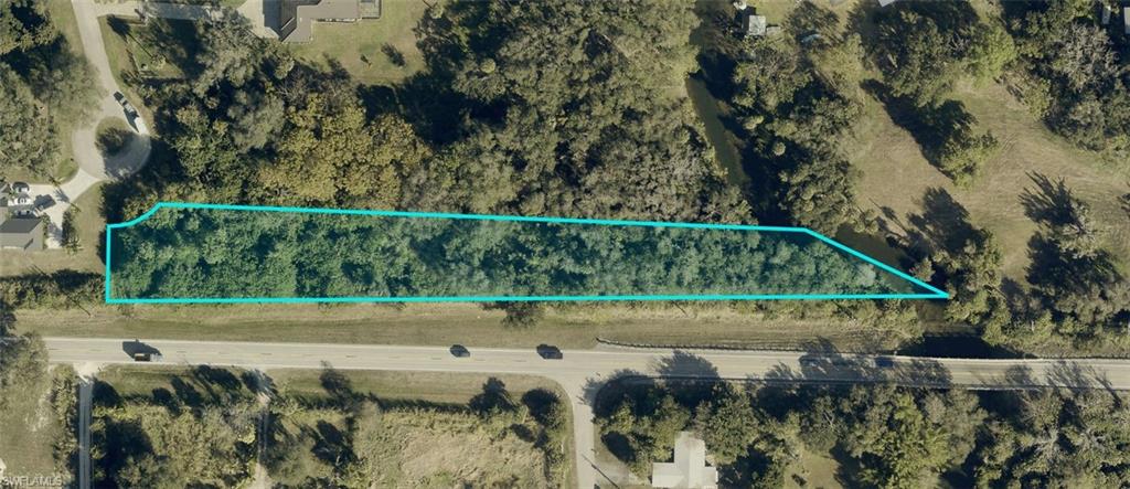 Rare Orange River opportunity! This beautiful 1.22-acre residential homesite offers approximately 110 feet of frontage along the scenic Orange River and is situated at the end of a quiet cul-de-sac. Surrounded by well-maintained Old Florida-style homes, mature oaks, and natural beauty, this estate-sized parcel offers plenty of space and privacy for your custom dream home. Enjoy riverfront living with access to the Orange River, Caloosahatchee River, and ultimately the Gulf of Mexico. A truly special homesite offering space, privacy, and a unique waterfront setting.