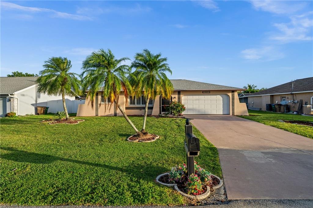A tastefully updated and beautifully maintained 3-bed, 2-bath pool home in a convenient Cape Coral location - this home is priced to sell! Remodeled in 2022, you’ll find a gem that blends style, comfort, character, and thoughtful enhancements. The easy to maintain new(er) laminate flooring, 5-inch baseboards, crown molding, plantation shutters, and the split floor plan all say “welcome." Bright and cheerful cabinetry abounds in the kitchen offering tall, soft-close cabinetry with crown caps, soft-close doors and drawers, quartz countertops, a ceramic tile backsplash, a dedicated coffee and wet bar, and newer LG appliances. Refrigerator - 2025. The primary bedroom and ensuite have also been updated with barn door entry, fashionable, modern fixtures, crown molding, and a walk-in closet. The guest bathroom has also been updated with quality cabinets and quartz countertops. You'll enjoy the SW Florida lifestyle while overlooking your heated pool and garden-rich yard from the comfort of your expansive, stamped concrete lanai - providing additional and enjoyable outdoor living space. Gardening is a pleasure with raised flower beds, a fruit cocktail tree, and a lemon tree. The yard is fully fenced - a playground for children and/or pets. Need extra storage? A storage shed is already in place. Additional Upgrades Include: Roof with 3rd Nail for Insurance Savings - 2022 | AC - 2021 | AC Ductwork - 2023 | Repiped - 2021 | Electrical Panel? - 2021 | Hurricane Rated Garage Door - 2021 | Water Heater - 2025 | Lanai Cage Screens - 2023 | Pool Heater - 2026 | Pool Pump - 2022 | Plantation Shutters - 2022 | Fence - 2024 | Shed - 2024 | Barn Door - 2024. This home is move-in ready. It's not in a flood zone so flood insurance is required. All Cape Coral utilities are in place and all assessments are paid. Perfectly positioned just minutes from the Cape Coral Hospital, boutique and retail shopping, casual and fine dining are minutes away. Golf, boating, and everything Cape Coral has to offer is yours to be had. Let’s make this home – your home.